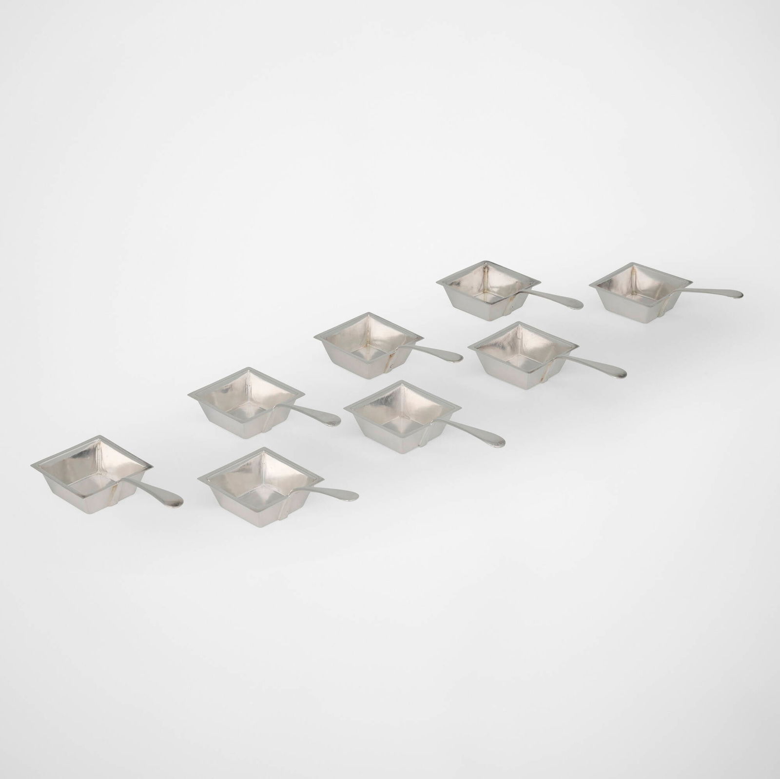 Henry Wilkinson & Co., Ltd., Salt cellars with handles, set of eight: Henry Wilkinson & Co., Ltd. Salt cellars with handles, set of eight Sheffield, United Kingdom, c. 1880 electroplated silver 1.375 h x 2.125 w x 4.375 d in (3 x 5 x 11 cm) Impressed maker's marks