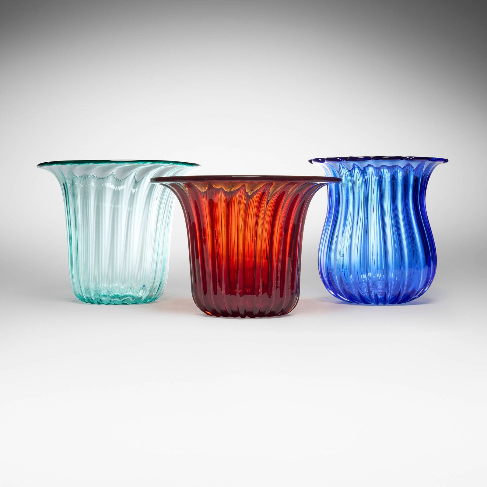 Zora da Venezia, Vases, set of three: Zora da Venezia Vases, set of three Italy, late 20th century glass 14 h x 13.5 dia in (36 x 34 cm) 12 h x 16.5 dia in (30 x 42 cm) 13.5 h x 16 dia in (34 x 41 cm) Etched signature to underside of