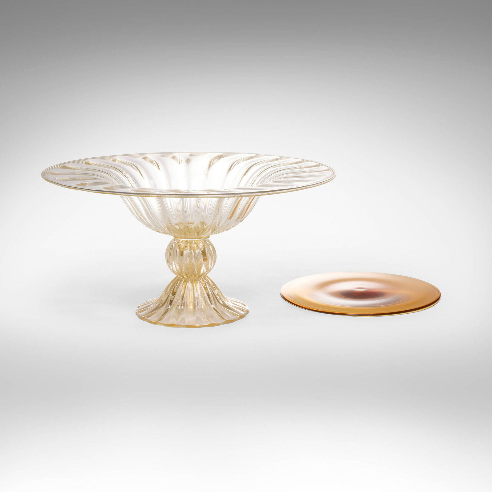 Zora da Venezia, Tazza and roundel: Zora da Venezia Tazza and roundel Italy, late 20th century glass 12 h x 32.5 dia in (30 x 83 cm) 0.125 h x 13.75 dia in (0 x 35 cm) Etched signature to underside of each example 'Zora da Venezia