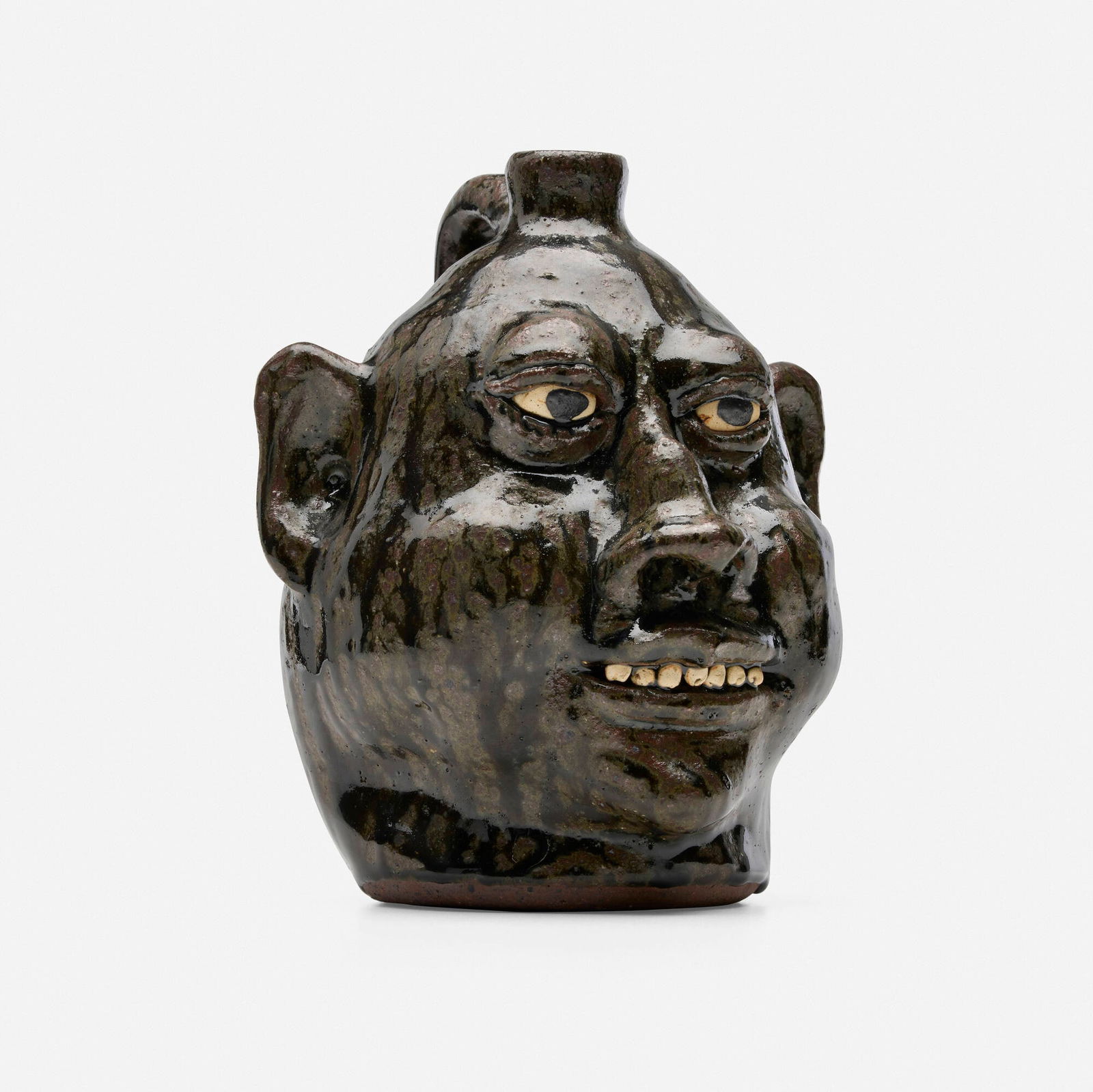 Lanier Meaders, Face jug: Lanier Meaders Face jug c. 1975glazed earthenware 8.25 h x 7 dia in (21 x 18 cm) Incised signature to underside 'Lanier Meaders'. This work will ship from Chicago, Illinois