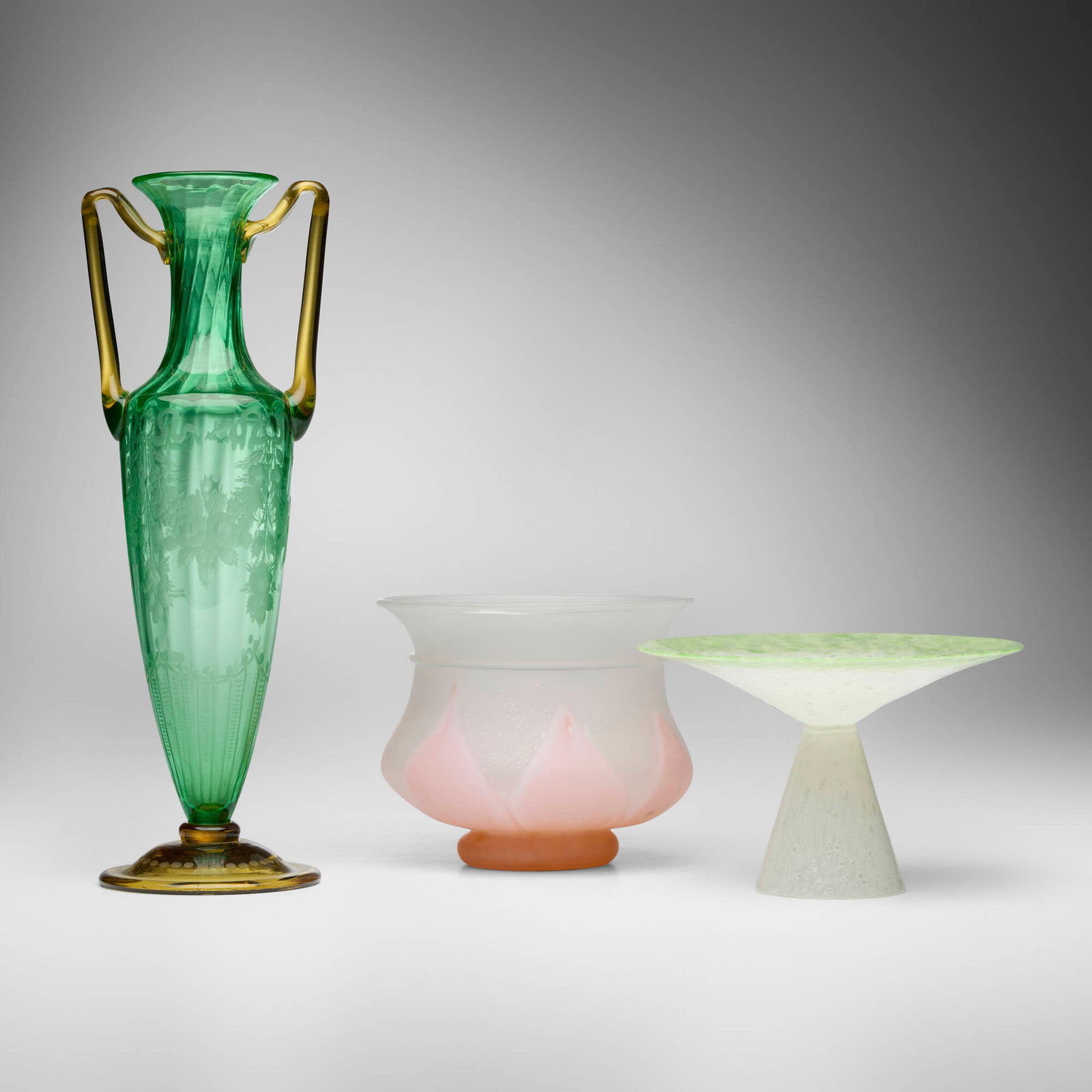 Steuben, Collection of three works: Steuben Collection of three works USA, c. 1915-30hand-blown Pomona Green and Amber glass, hand-blown Cinnamon and colorless glass, hand-blown glass 15 h x 5.5 w x 4.5 d in (38 x 14 x 11 cm) 5.75 h