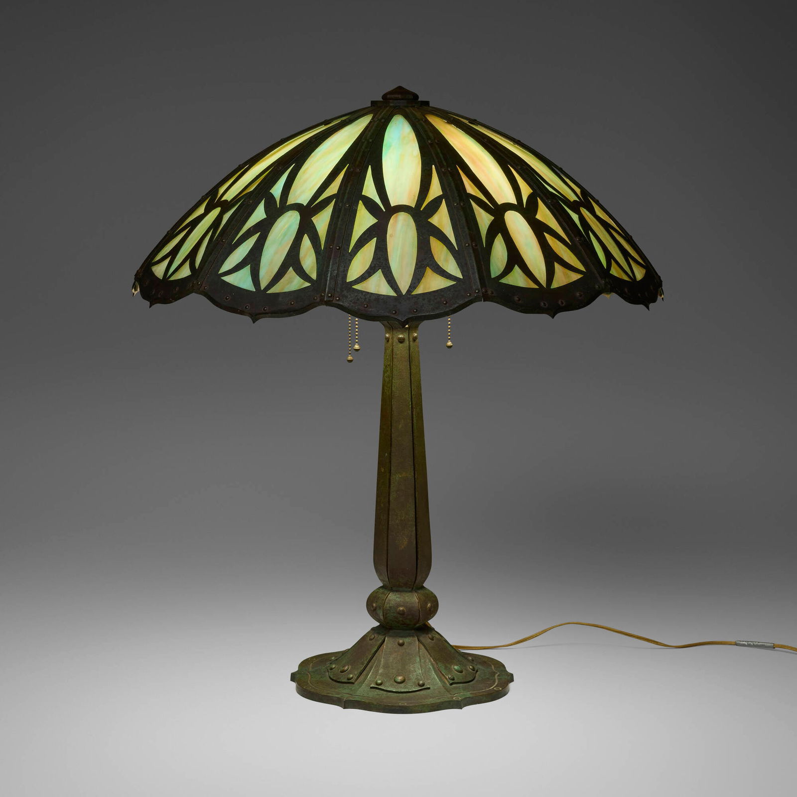 Bradley & Hubbard, Large overlay table lamp: Bradley & Hubbard Large overlay table lamp USA, c. 1915 patinated iron, slag glass 28 h x 24 dia in (71 x 61 cm) Provenance: Collection of Gary Diamond, Los Angeles This work will ship from
