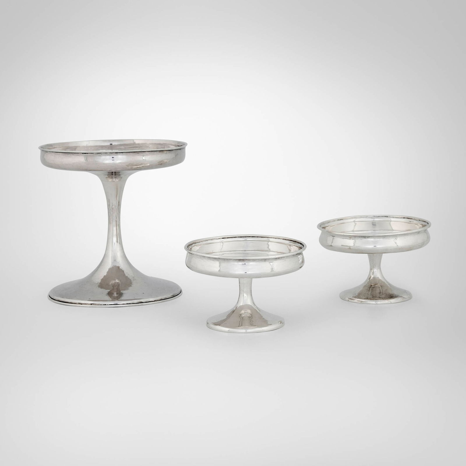 The Kalo Shop, Collection of three compotes: The Kalo Shop Collection of three compotes Chicago, USA, c. 1908-11, first half of the 20th century sterling silver 5.5 h x 5.5 dia in (14 x 14 cm) 2.5 h x 4 dia in (6 x 10 cm) Collection includes