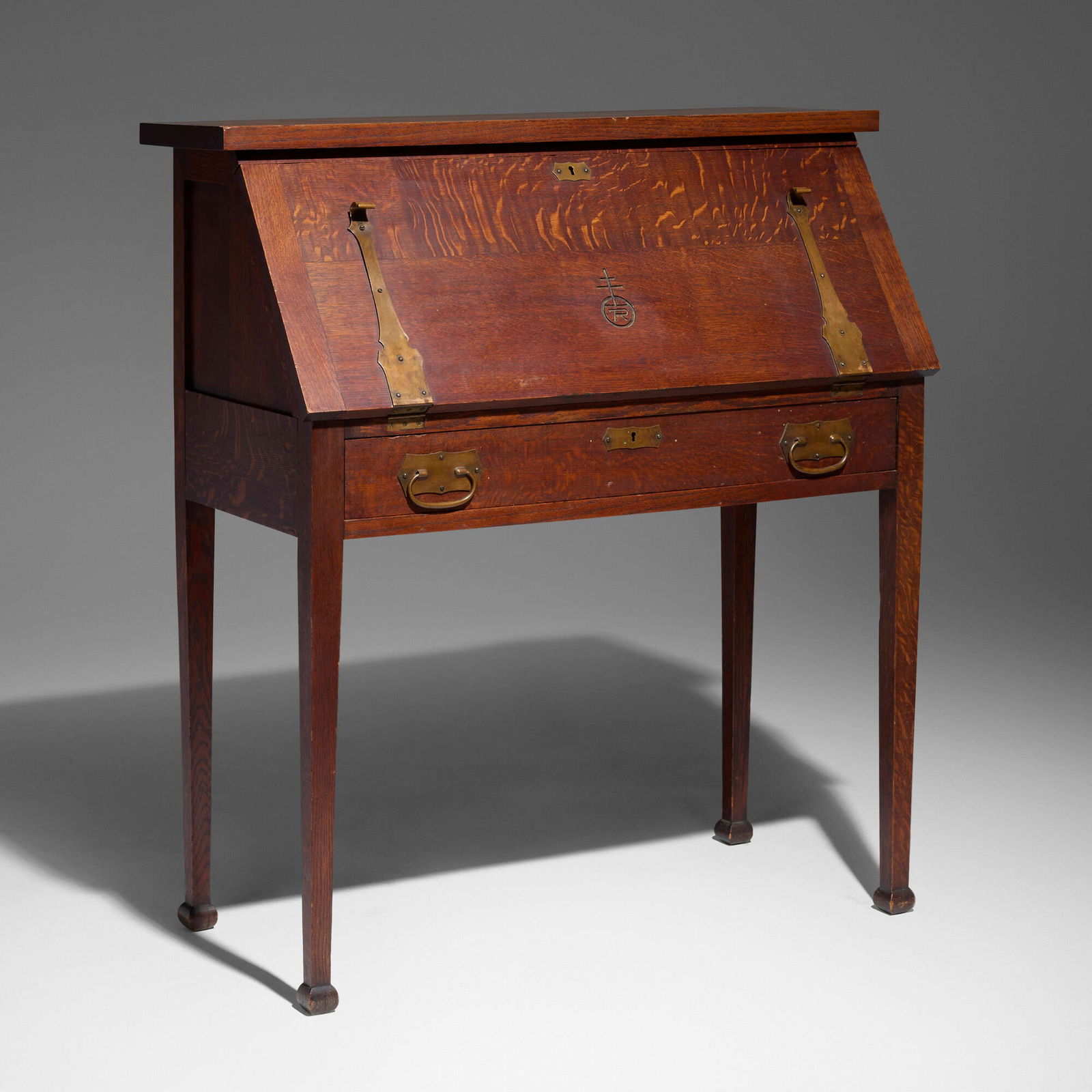 Roycroft, Writing desk, model 091: Roycroft Writing desk, model 091 USA, c. 1906 oak, copper 44.5 h x 39 w x 19 d in (113 x 99 x 48 cm) Desk features a drop-front writing surface concealing ten storage compartments. Carved orb and