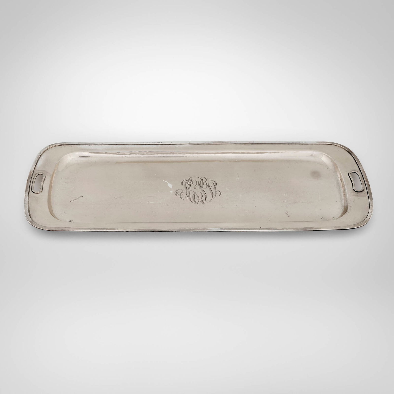 Falick Novick, Cocktail tray: Falick Novick Cocktail tray Chicago, USA, c. 1910 sterling silver 0.875 h x 22.75 w x 9.5 d in (2 x 58 x 24 cm) Impressed manufacturer's mark to underside 'Sterling Handwrought by F. Novick