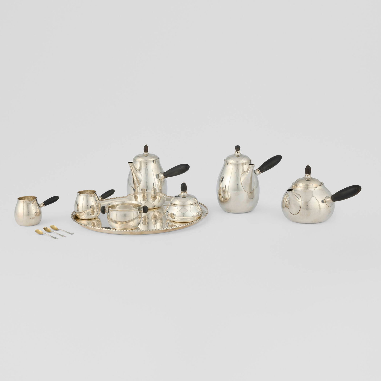 Georg Jensen, Perl coffee, tea and hot chocolate service: Georg Jensen Perl coffee, tea and hot chocolate service Georg JensenDenmark, c. 1915-16 / c. 1934sterling silver, ebony, sterling silver parcel-gilt taller pot: 6.5 h x 7 w x 5 d in (17 x 18 x