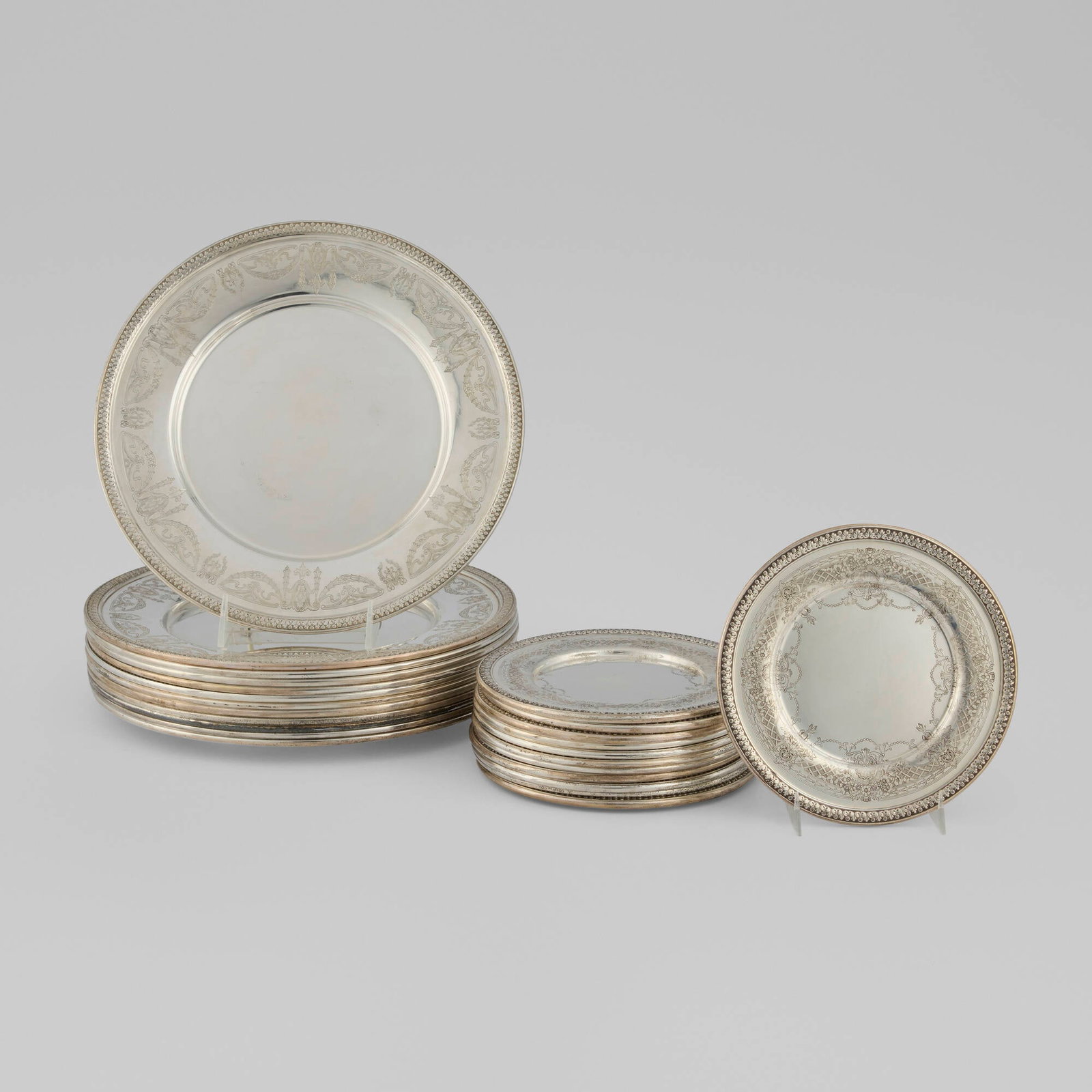 American, Collection of dinnerware with Rococo-style motifs: American Collection of dinnerware with Rococo-style motifs c. 1890 sterling silver 0.375 h x 11 dia in (1 x 28 cm) 0.25 h x 6.75 dia in (1 x 17 cm) Collection is comprised of twelve dinner plates