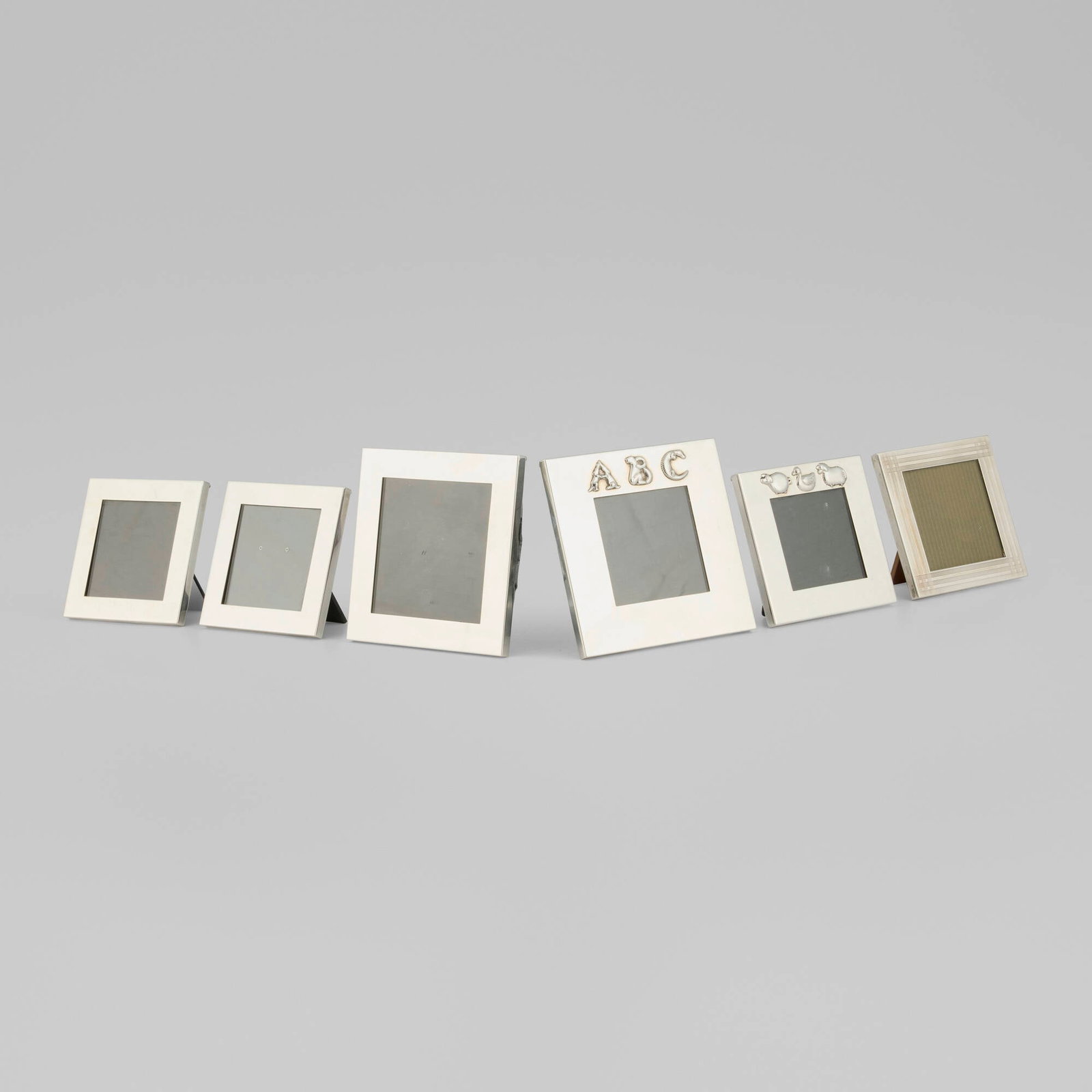 Tiffany & Co., Collection of six picture frames: Tiffany & Co. Collection of six picture frames New York, USA, c. 2002sterling silver, glass, synthetic leather, wood 5 h x 5 w x 0.625 d in (13 x 13 x 2 cm) 4 h x 4 w x 0.625 d in (10 x 10 x 2 cm)