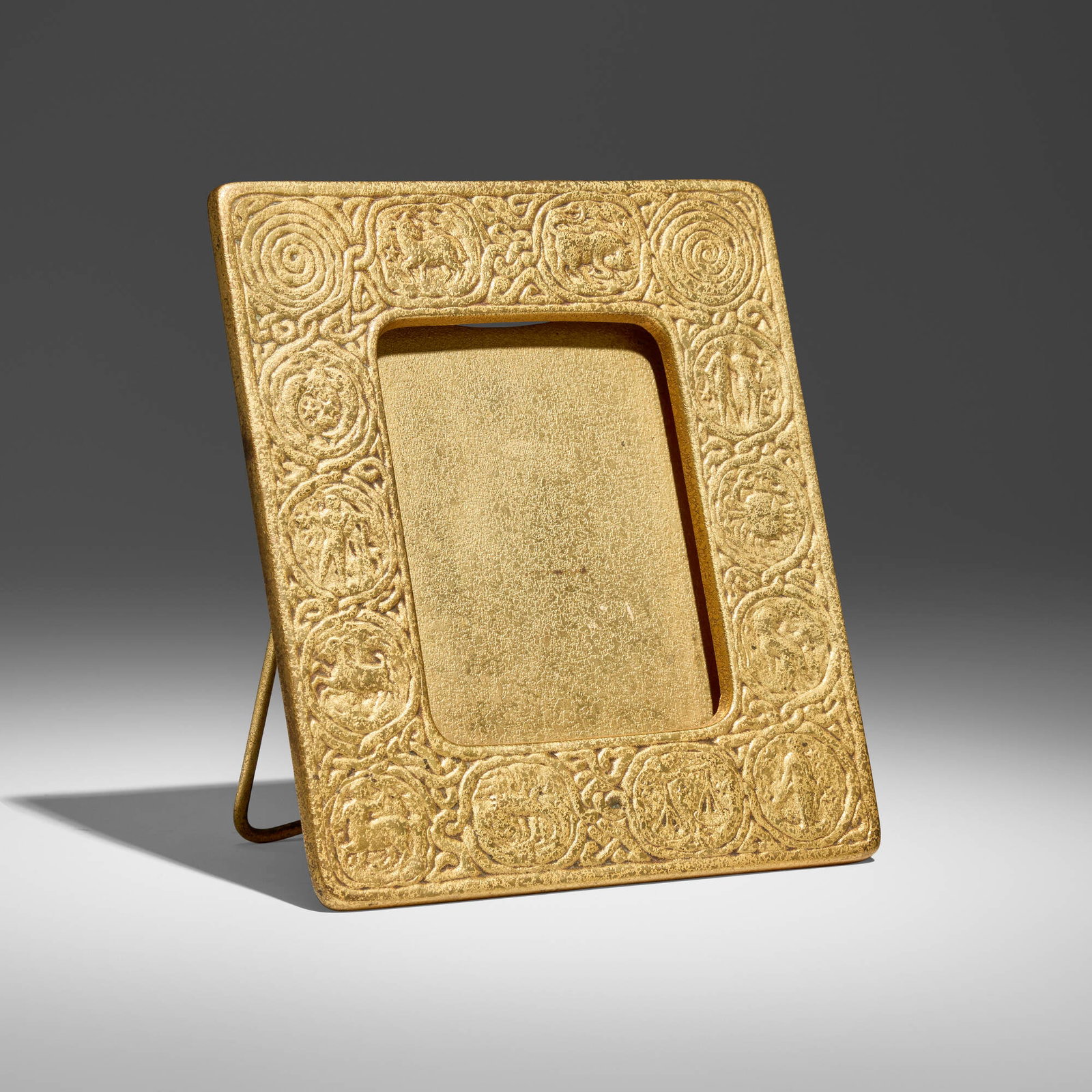 Tiffany Studios, Zodiac picture frame: Tiffany Studios Zodiac picture frame USA, c. 1920acid-etched and gilt bronze 8.25 h x 7.125 w x 5 d in (21 x 18 x 13 cm) Impressed to reverse 'TIFFANY STUDIOS NEW YORK 942'. Pro