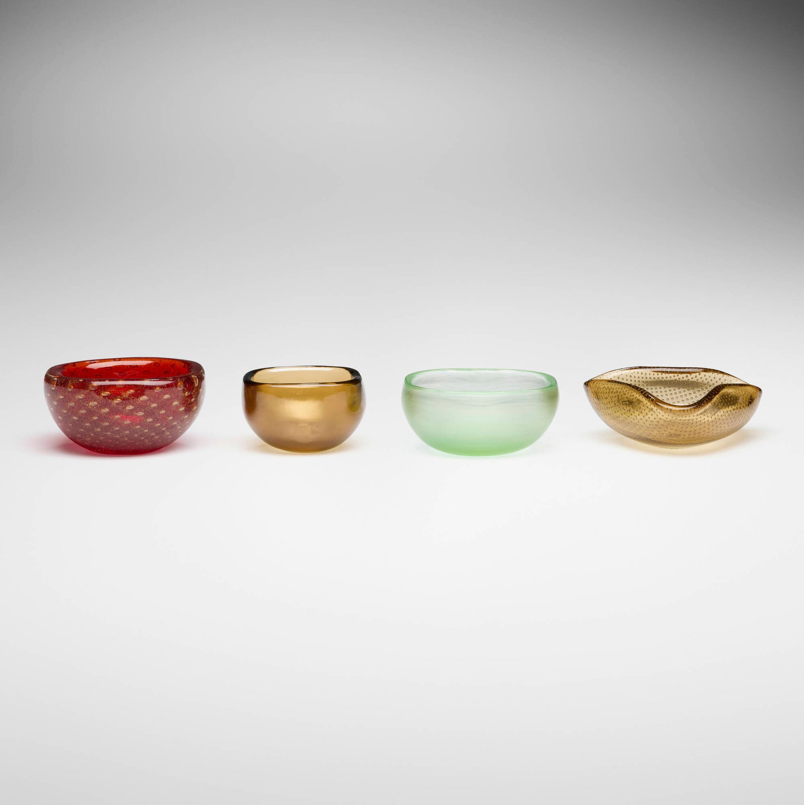 Venini, Collection of four Murano dishes: Venini Collection of four Murano dishes Italy, second half of the 20th century glass largest: 2 h x 4.75 w x 4 d in (5 x 12 x 10 cm) smallest: 2 h x 3.25 w x 3.25 d in (5 x 8 x 8 cm) Signed with