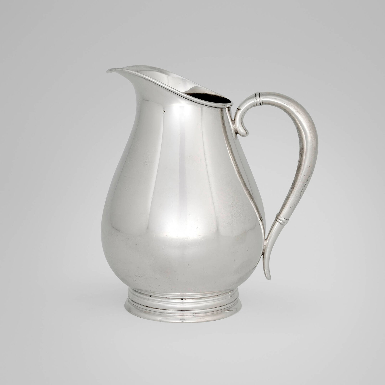 Alfred G. Kintz, Royal Danish water pitcher: Alfred G. Kintz Royal Danish water pitcher International Silver Company USA, 1939 sterling silver 8.375 h x 7 w x 5.375 d in (21 x 18 x 14 cm) Impressed manufacturer's mark to underside 'Royal