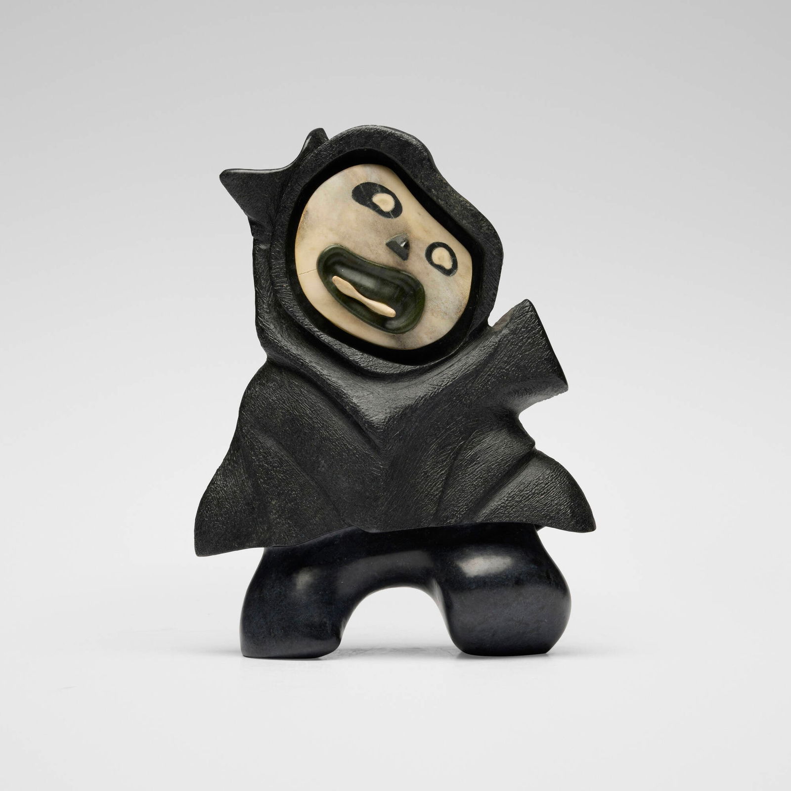 Michael Massie, Inuit Figure: Michael Massie Inuit Figure 1974 soapstone, serpentine, bone 10.75 h x 8 w x 4.25 d in (27 x 20 x 11 cm) Incised signature and date to underside of one foot 'Massie 74'. Provenance: Property from