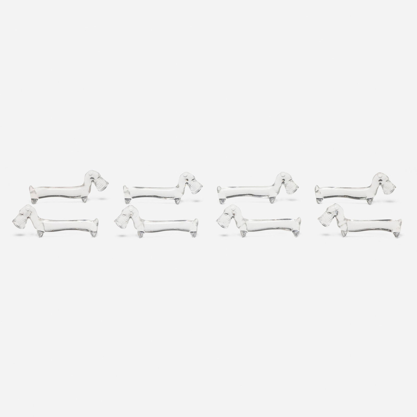 French, Art Deco Scottish terrier knife rests, set of eight: French Art Deco Scottish terrier knife rests, set of eight c. 1930 glass 1.5 h x 4.25 w x 0.75 d in (4 x 11 x 2 cm) This work will ship from Chicago, Illinois.