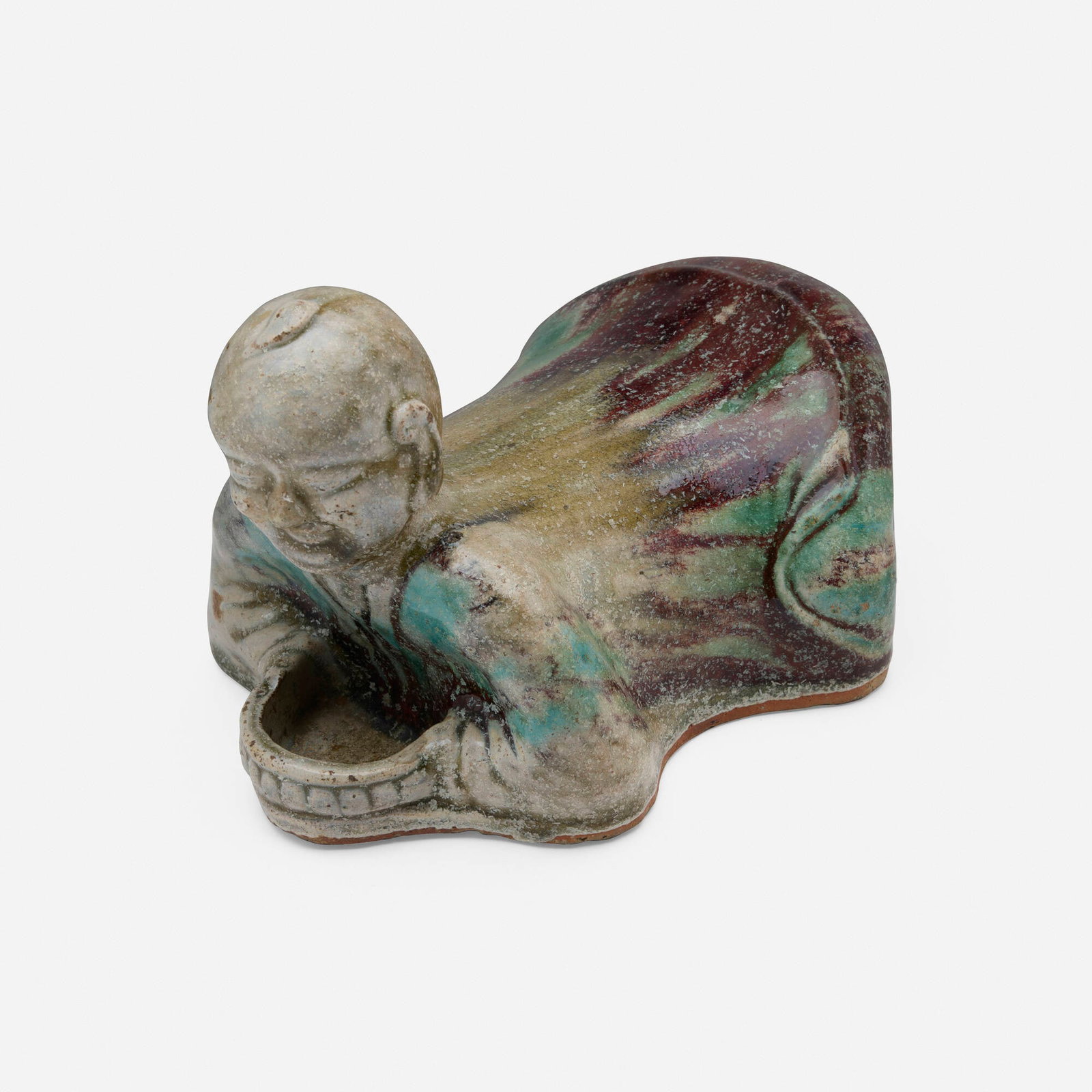Chinese, Ho Ho Boy headrest: Chinese Ho Ho Boy headrest 19th-20th century glazed stoneware 7 h x 10 w x 7 d in (18 x 25 x 18 cm) Provenance: Collection of Marlene Shatkin, Winnetka, IL This work will ship from Chicago,