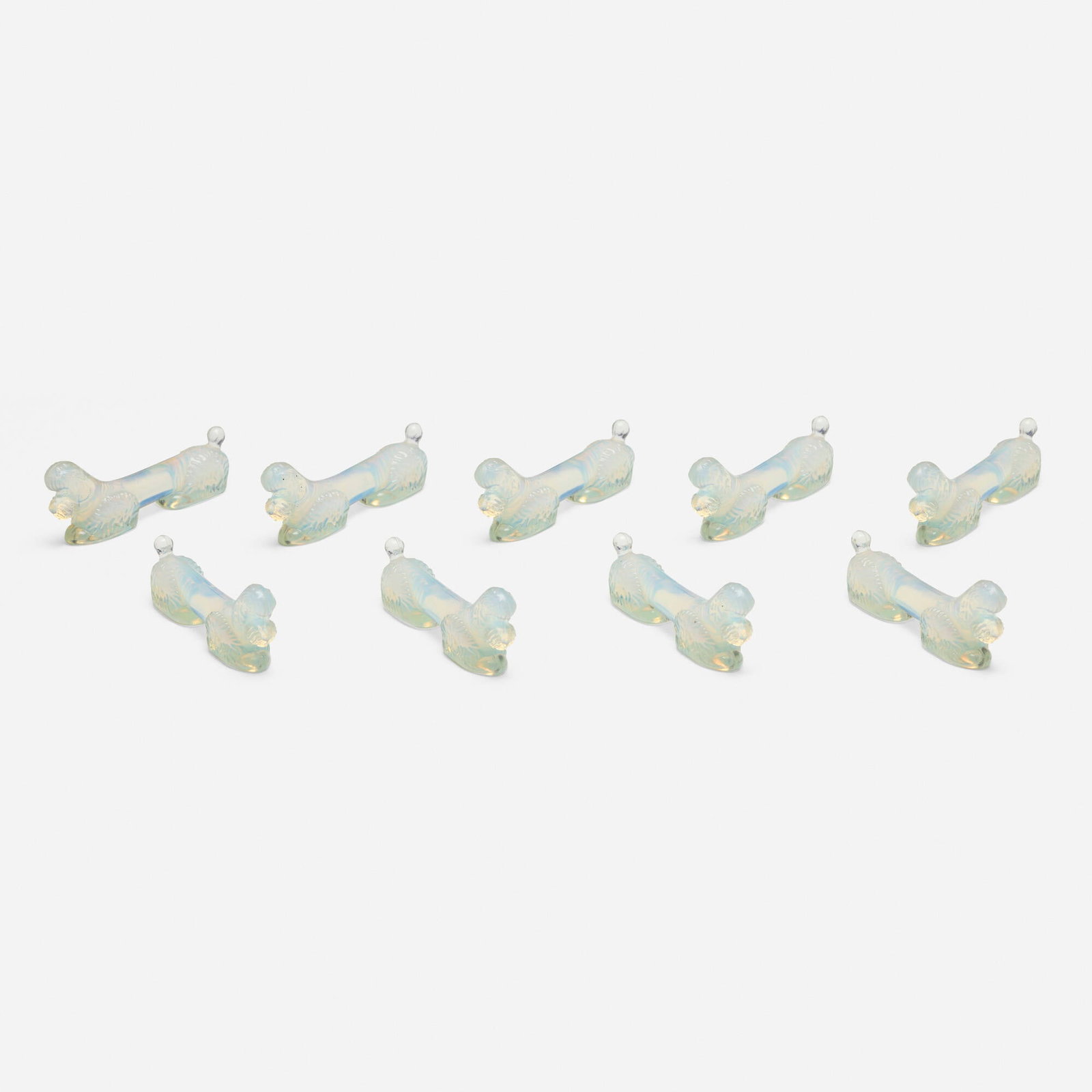 Sabino, Poodle knife rests, set of nine: Sabino Poodle knife rests, set of nine France, c. 1930opalescent glass 1.25 h x 3.25 w x 0.75 d in (3 x 8 x 2 cm) This work will ship from Chicago, Illinois.
