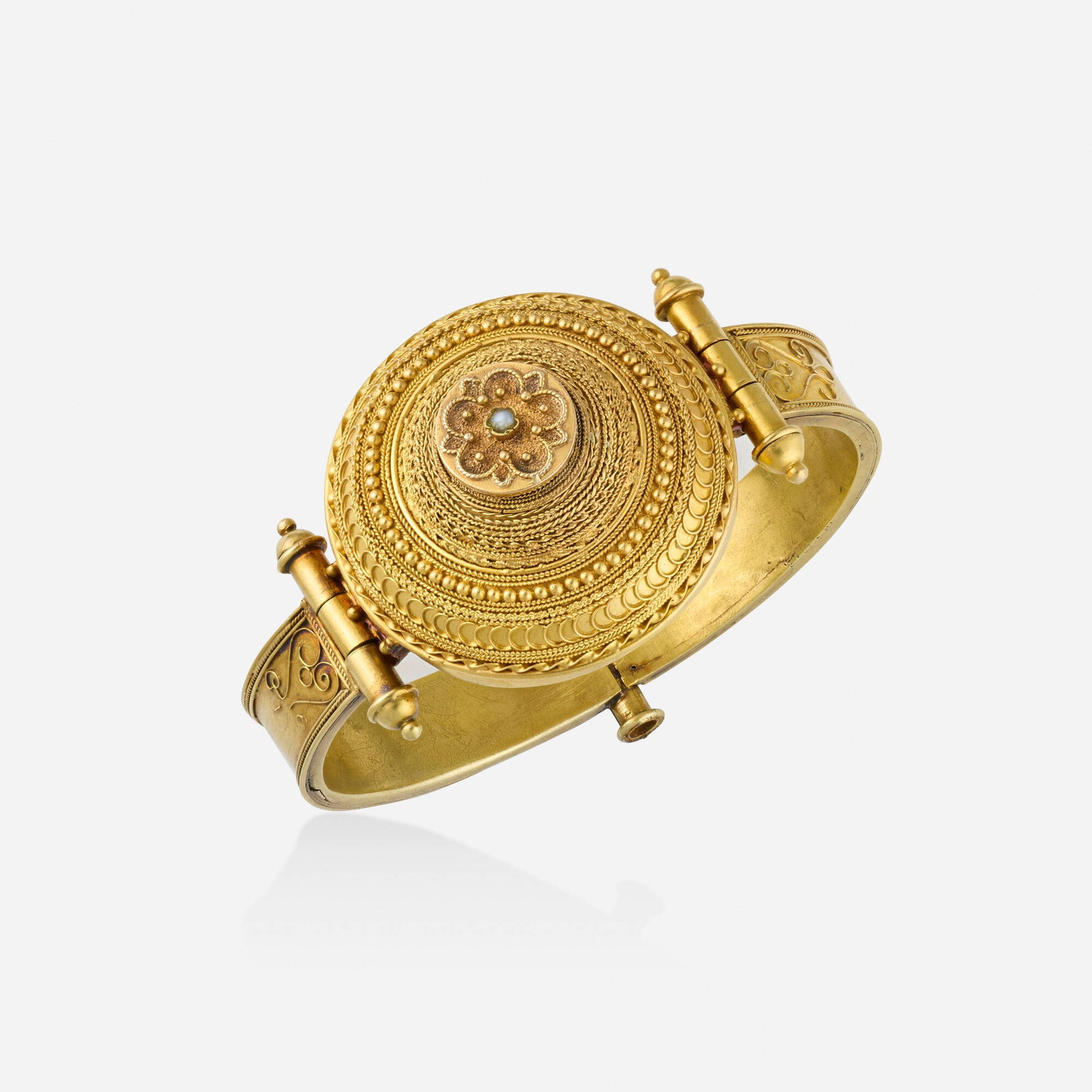 Etruscan Revival, Italian gold and seed pearl bracelet: Etruscan Revival Italian gold and seed pearl bracelet The hinged bangle of gold granulation and wirework, set with one seed pearl 18k yellow gold Inner circ. 6.25 in, width 2.375 in; Gross weight 22.5