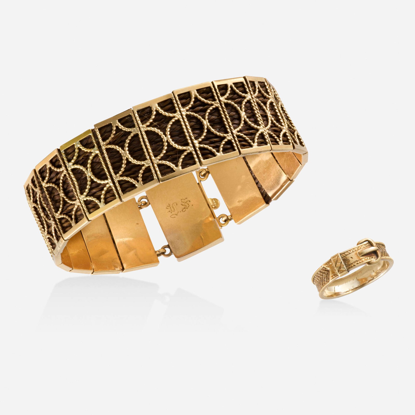 Victorian, Gold mourning bracelet and ring: Victorian Gold mourning bracelet and ring Each designed with woven hair Yellow gold Bracelet inner circ. 6.625 in, width 0.75 in, ring size 5.75; Gross weight 12.2 dwts This work will