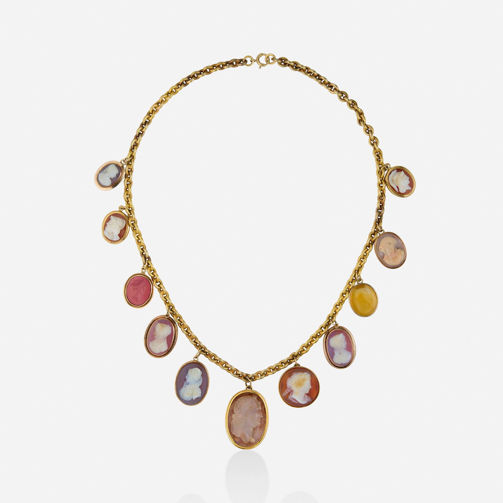 Antique, Cameo, intaglio, and gold necklace: Antique Cameo, intaglio, and gold necklace Designed with eleven cameo or intaglio pendants suspended from the oval link chain Yellow gold 21.25 in; Gross weight 61.2 dwts This work wil