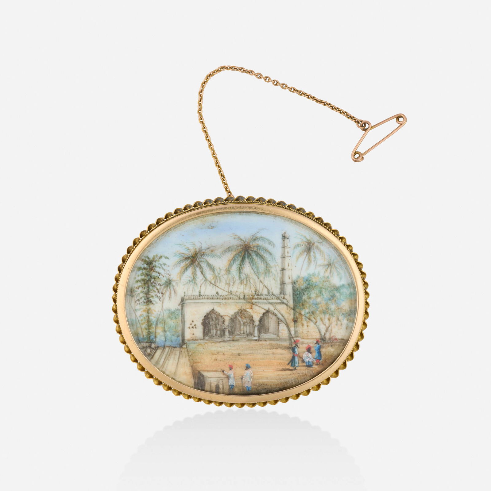 Grand Tour, Landscape miniature brooch: Grand Tour Landscape miniature brooch The front depicting hand painted palm trees and village, the reverse with locket and photograph portrait Yellow and pink gold 2 x 1.625 in; Gross weight 16.0 dwts