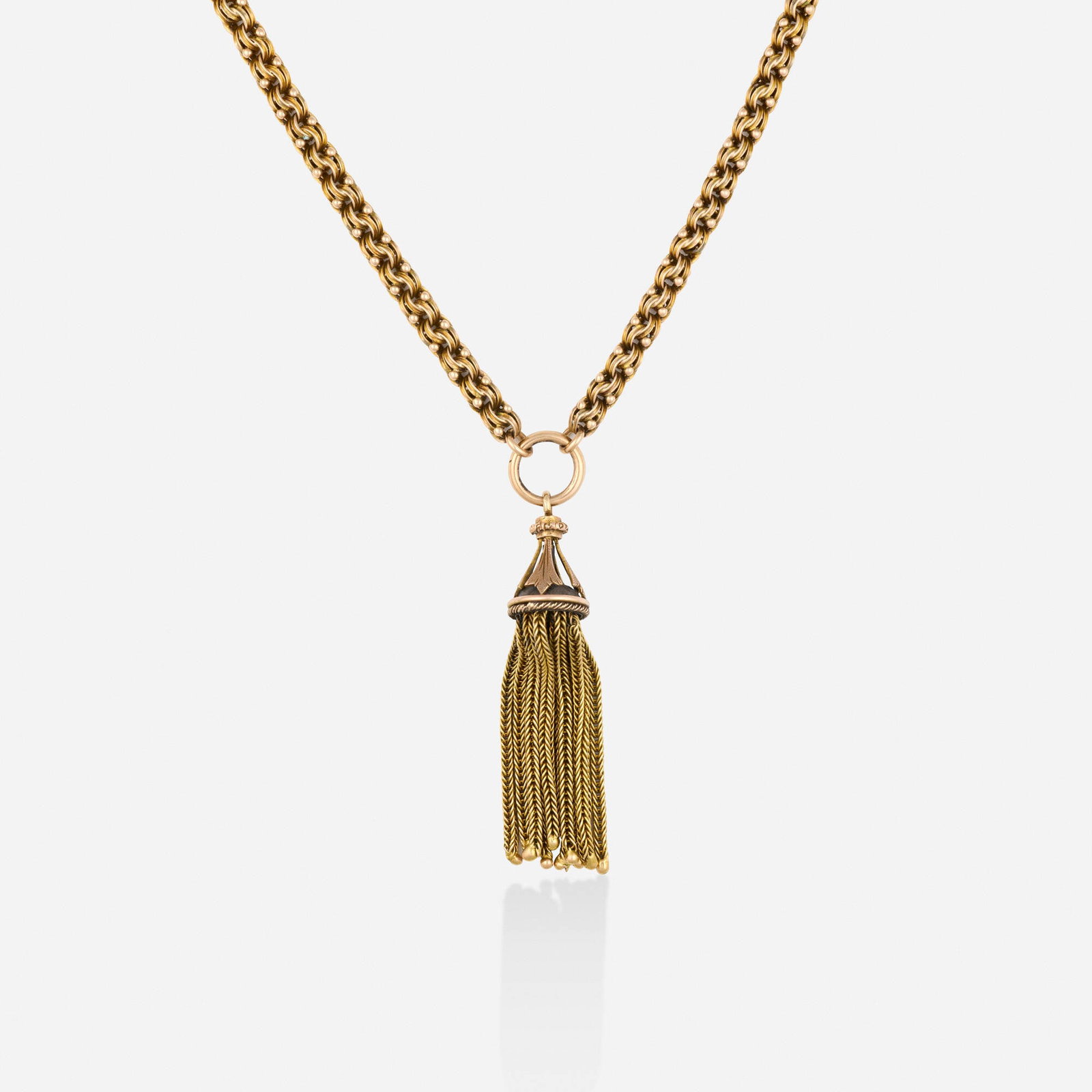 Victorian, Gold necklace: Victorian Gold necklace Of fancy links and a chain tassel Yellow gold Necklace 22.25 in, tassel 2 x 0.375 in; Gross weight 21.0 dwts This work will ship from Lambertville, New Jersey.<