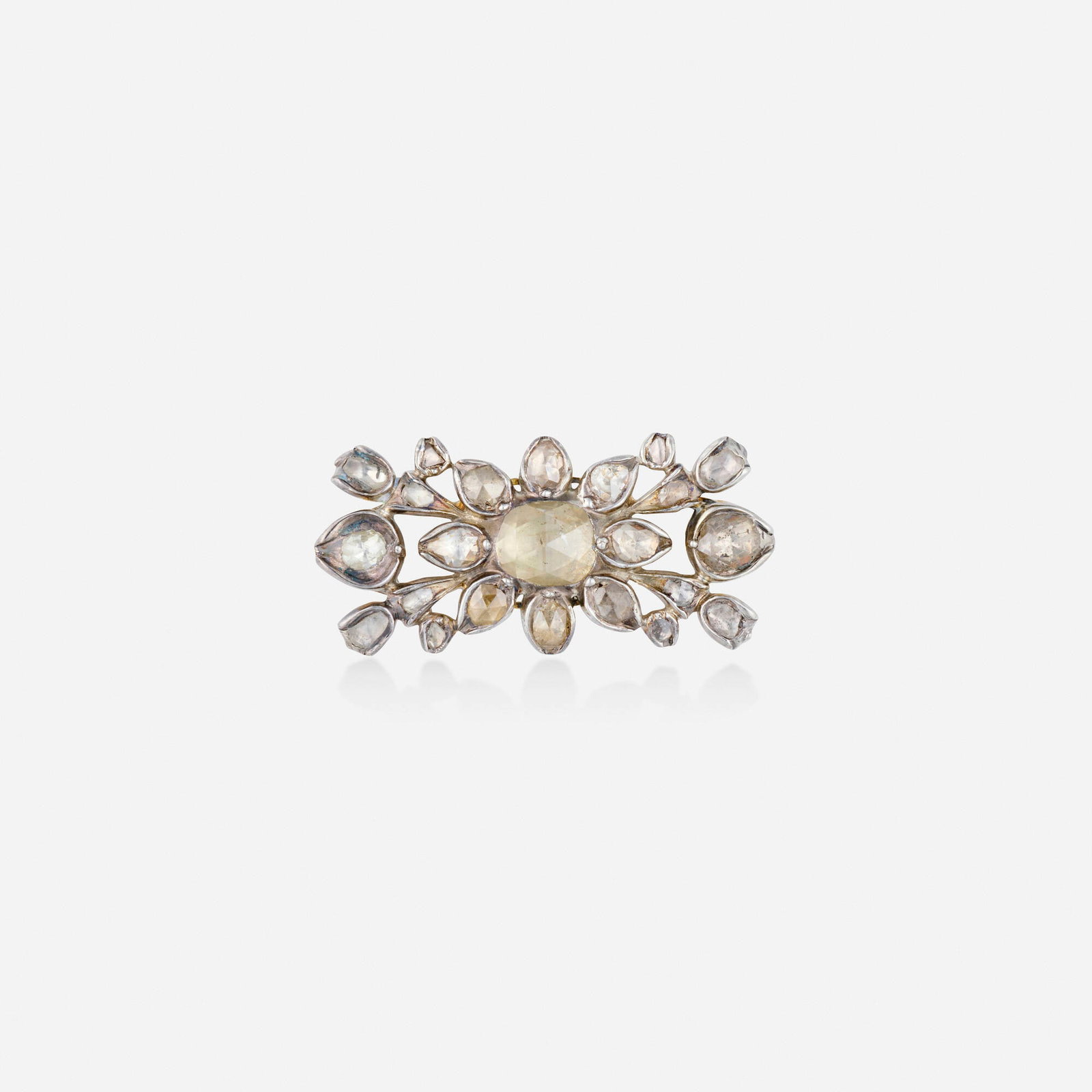 Georgian, Diamond, silver, and gold brooch: Georgian Diamond, silver, and gold brooch Set with rose-cut diamonds Silver and yellow gold 1.25 x 0.625 in; Gross weight 4.6 dwts This work will ship from Lambertville, New Jersey.