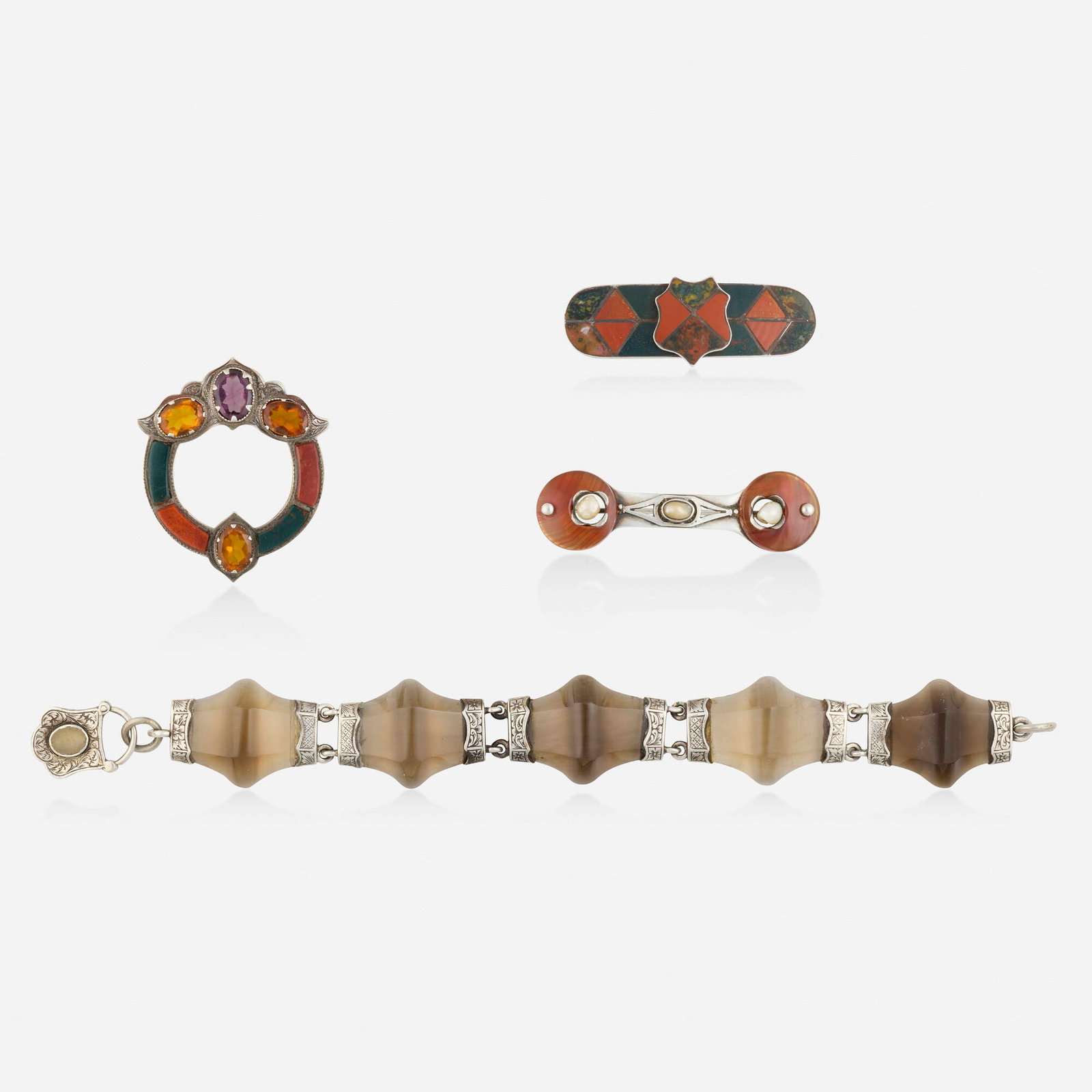 Scottish, Victorian group of multi-gem and silver jewelry: Scottish Victorian group of multi-gem and silver jewelry Comprising a bracelet of carved smoky quartz joined by lock clasp set with agate; a brooch set with slices of jasper and bloodstone, oval-cut c