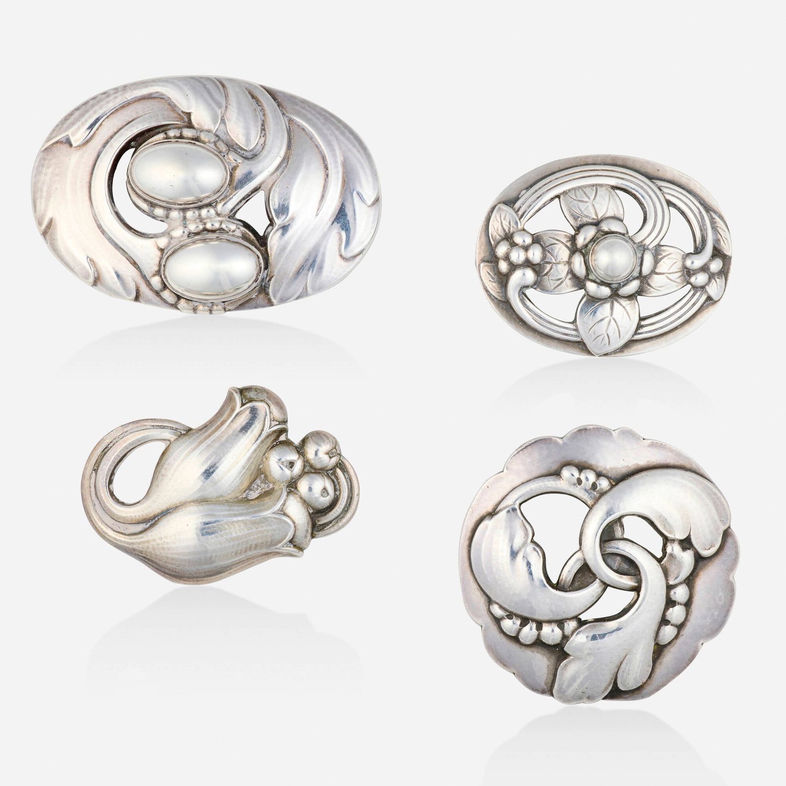 Georg Jensen, Arts & Crafts group of sterling silver brooches: Georg Jensen Arts & Crafts group of sterling silver brooches Lori Ulanova was one of the first female violinists in the Los Angeles Philharmonic Comprising four brooches, one of oval foliate design, n