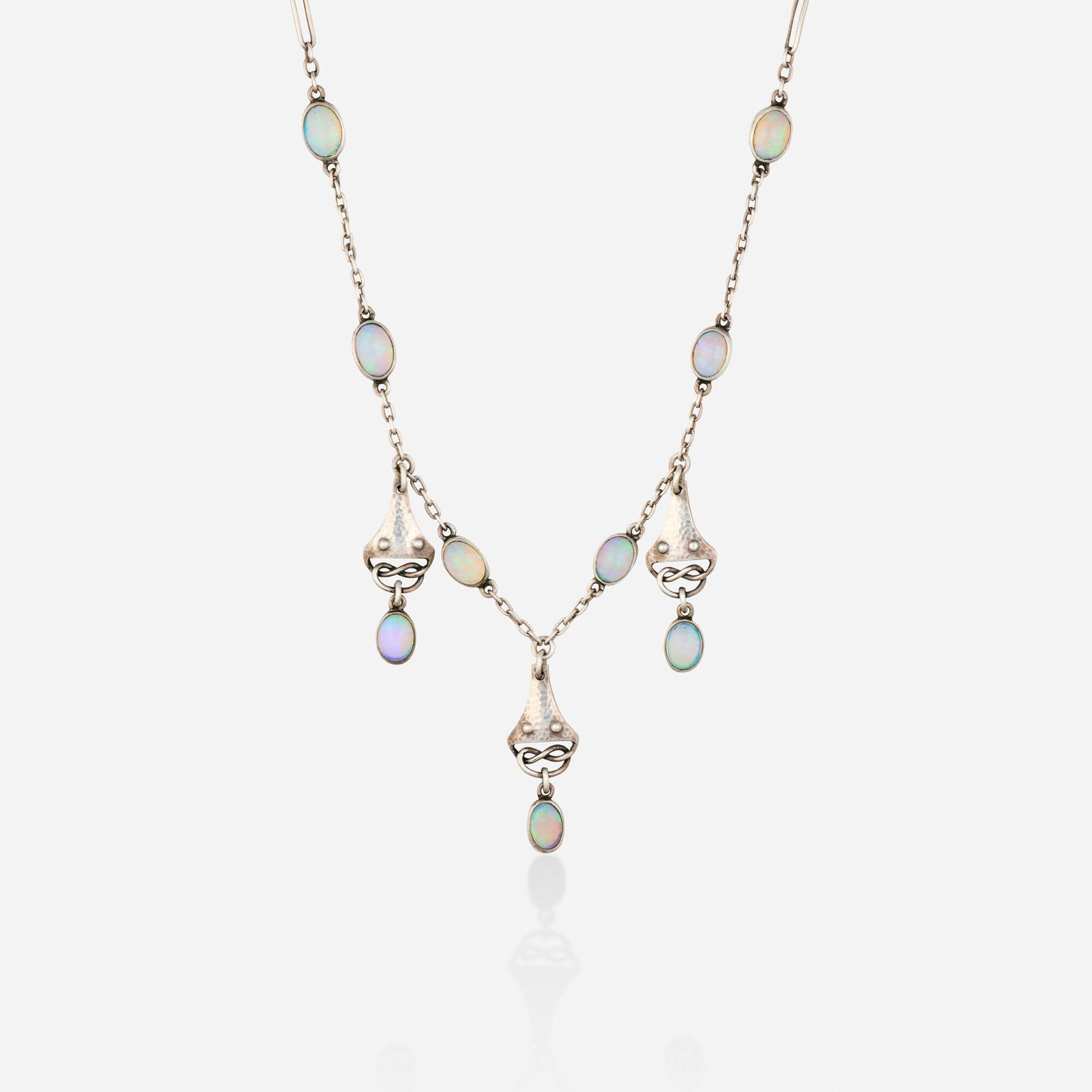 Murrle, Bennett & Co., Celtic Revival opal and silver necklace: Murrle, Bennett & Co. Celtic Revival opal and silver necklace Designed with hammered pendants and cabochon opals; 1900s Silver Signed with maker's mark for Murrle, Bennett & Co. Necklace 18.75 in, p