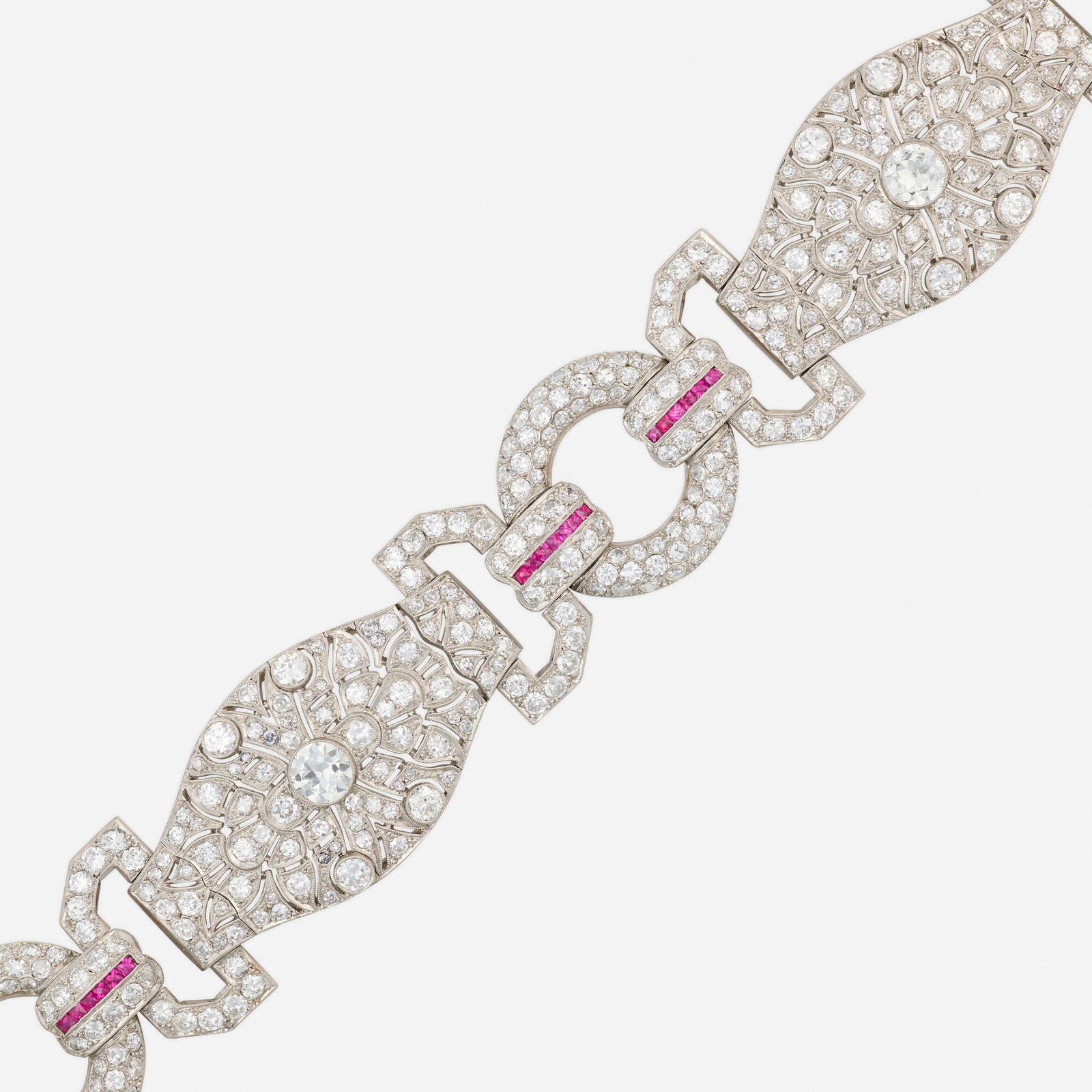 Art Deco, Diamond, ruby, and platinum bracelet: Art Deco Diamond, ruby, and platinum bracelet Set with French-cut rubies, old European and single-cut diamonds Platinum 7.25 x 1; Gross weight 41.6 dwts This work will ship from Lamber
