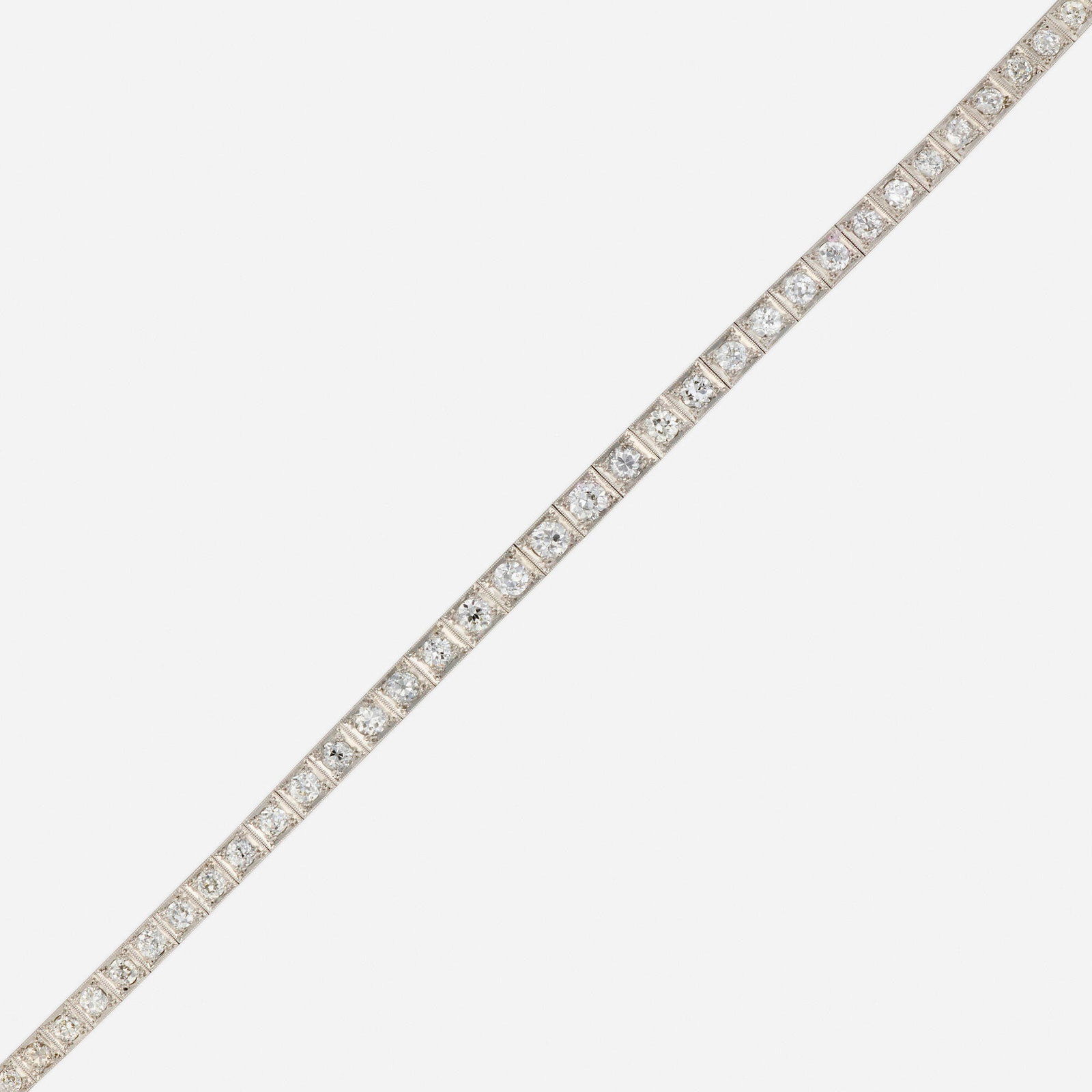 Art Deco, Diamond and platinum bracelet: Art Deco Diamond and platinum bracelet Set with a graduated line of old European-cut diamonds Platinum 7 in; Gross weight 12.1 dwts This work will ship from Lambertville, New Jersey.</