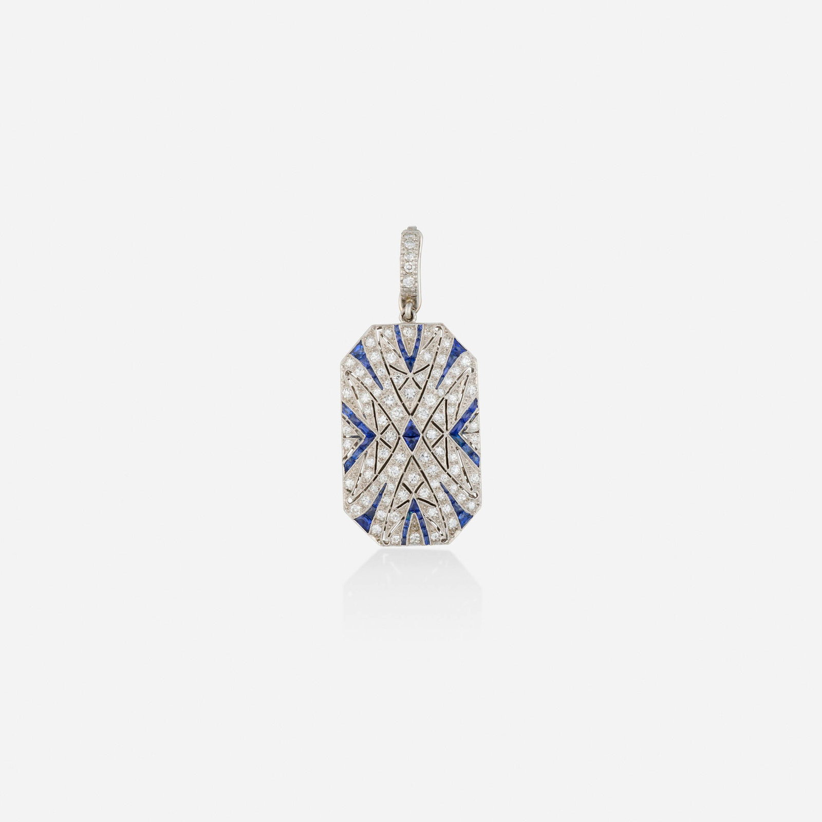 Art Deco, Sapphire, diamond, and platinum locket: Art Deco Sapphire, diamond, and platinum locket Set with calibre-cut sapphires and single-cut diamonds Platinum 1.625 x 0.75 in; Gross weight 7.0 dwts This work will ship from Lambertv