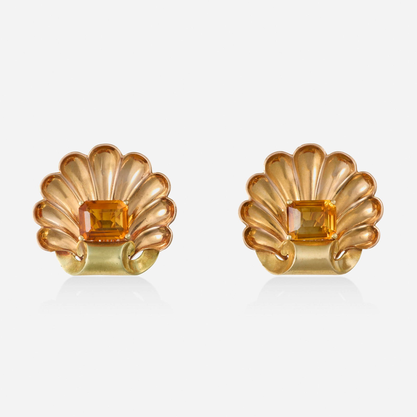 Retro, Citrine and bicolor gold earrings: Retro Citrine and bicolor gold earrings Each a scallop shell set with a rectangular-cut citrine Yellow and pink gold 1 x 1.125 in; Gross weight 9.3 dwts This work will ship from Lamber