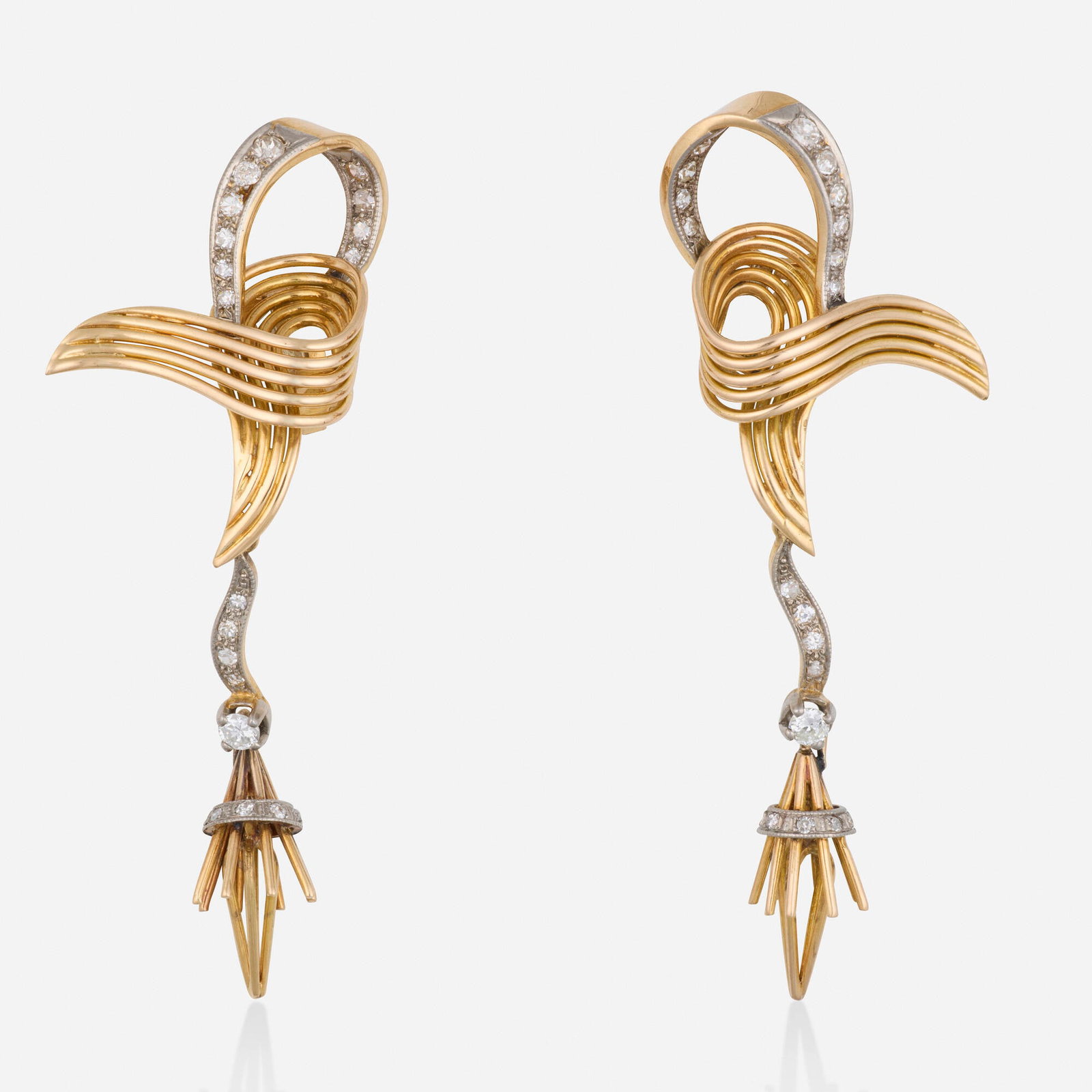 Retro, Diamond, gold, and platinum earrings: Retro Diamond, gold, and platinum earrings Lori Ulanova was one of the first female violinists in the Los Angeles Philharmonic Collection of Lori Ulanova Each of ribbon motif set with single-cut diamo