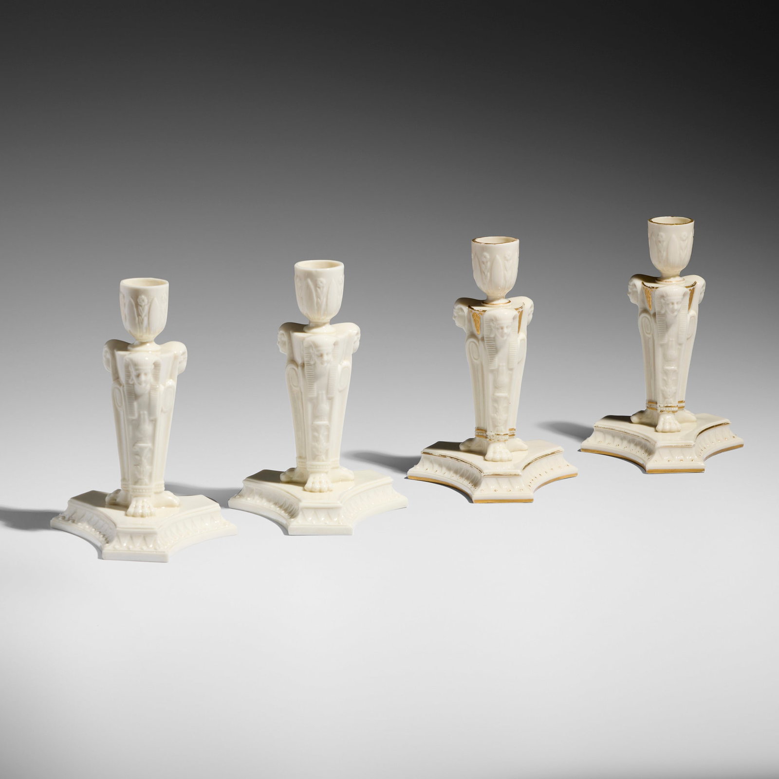 Royal Worcester, Egyptian Revival candlesticks, set of four: Royal Worcester Egyptian Revival candlesticks, set of four England, 1868 glazed and gilt porcelain 7.125 h x 5 w x 4.25 d in (18 x 13 x 11 cm) Impressed manufacturer's mark to underside of