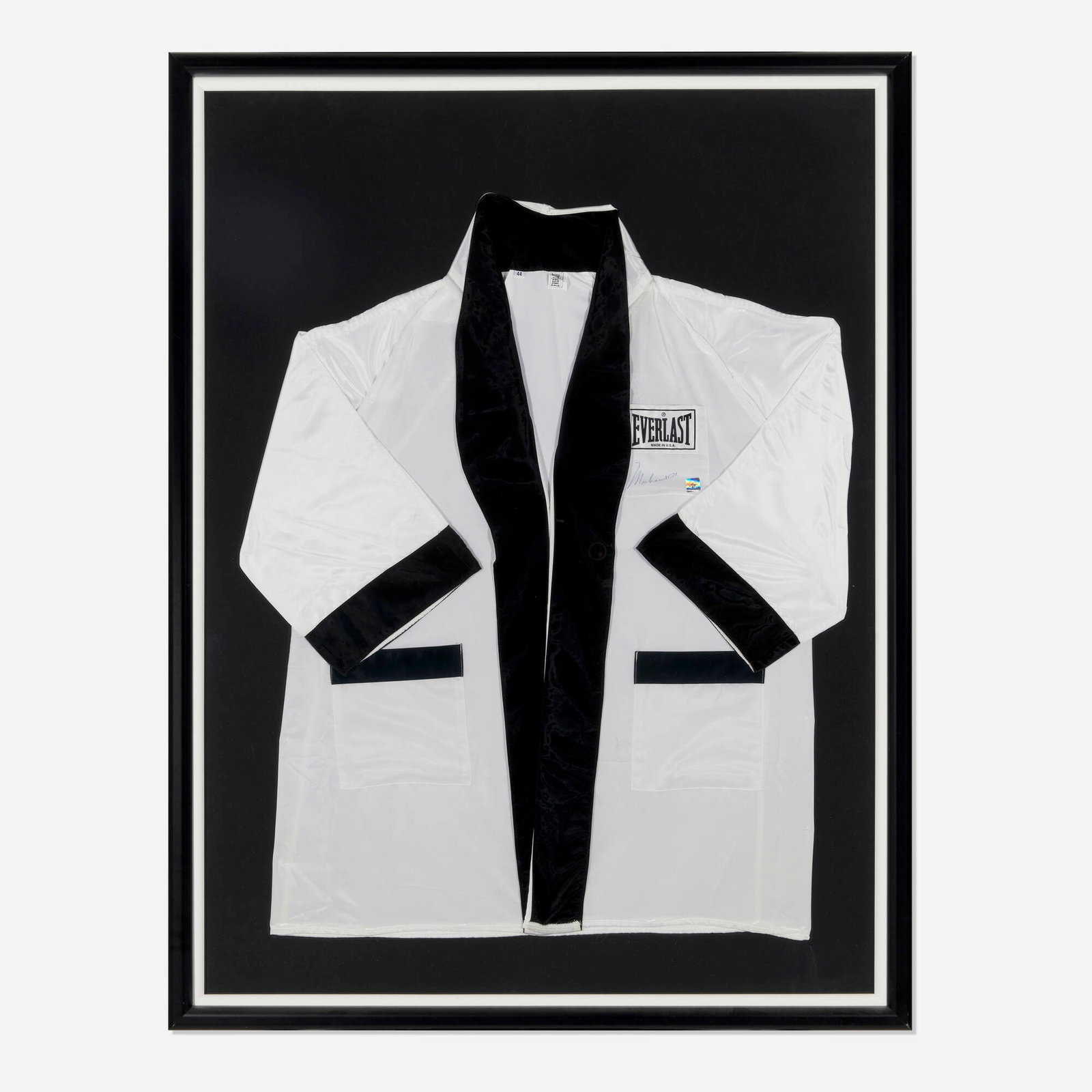 Muhammad Ali signed Everlast boxing robe: Muhammad Ali signed Everlast boxing robe c. 2000 polyester 38 h x 33 w in (97 x 84 cm) Signed to robe front 'Muhammad Ali' with holographic authentication label from Super Star Greetings.