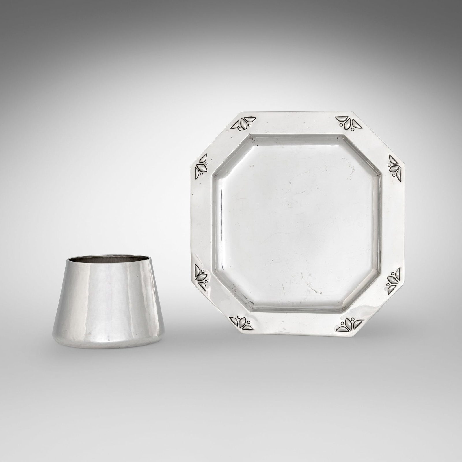 The Kalo Shop, Early octagonal plate and vase: The Kalo Shop Early octagonal plate and vase Park Ridge, USA, c. 1908-11 sterling silver 2.75 h x 3.5 dia in (7 x 9 cm) 7 h x 7 w x 0.25 d in (18 x 18 x 1 cm) Plate features repousse floral