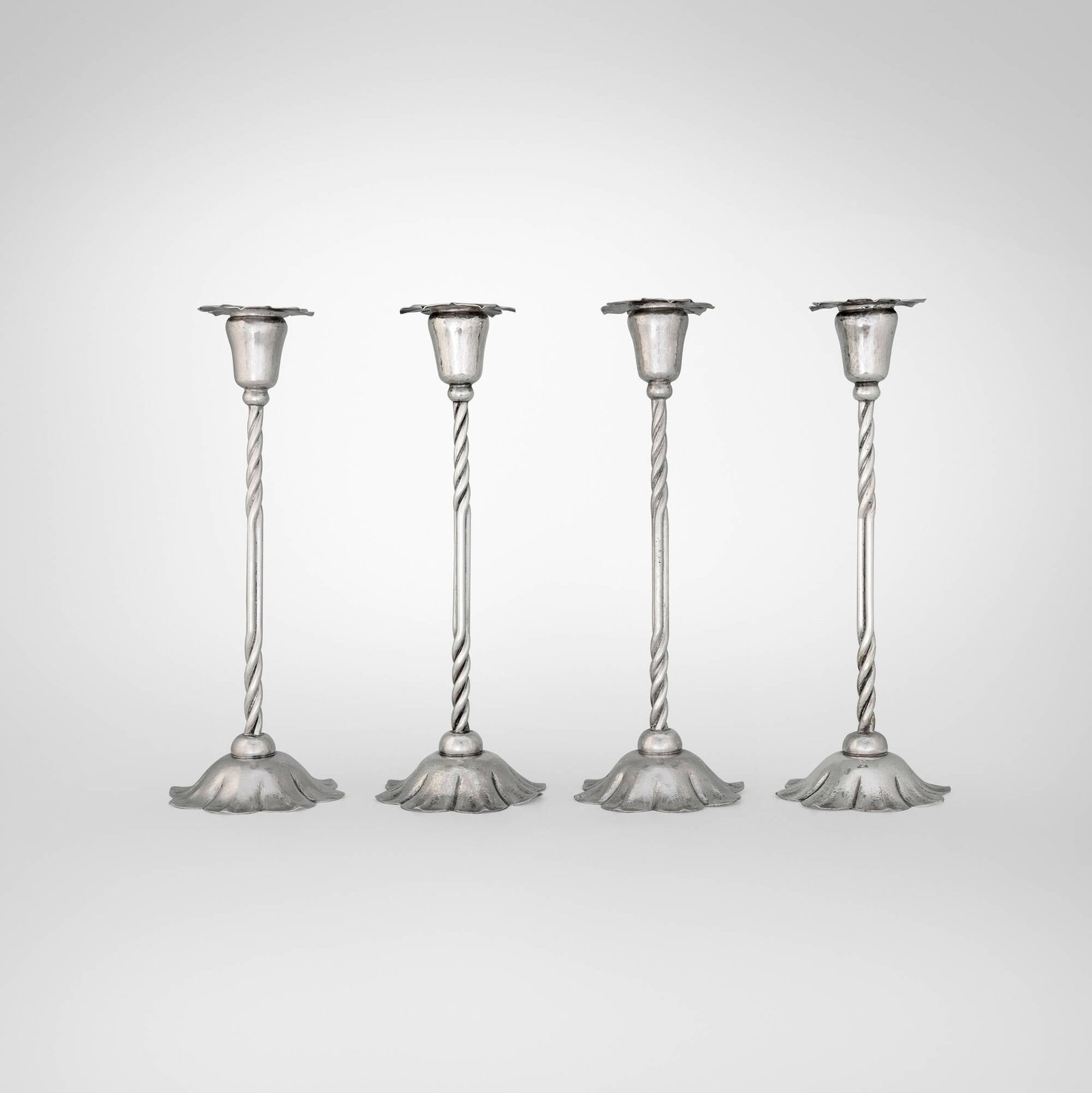 Marie Zimmermann, Floriform candlesticks, set of four: Marie Zimmermann Floriform candlesticks, set of four USA, c. 1925 pewter 14.25 h x 5.5 dia in (36 x 14 cm) Impressed signature to underside of each example 'M. Zimmermann Maker'.