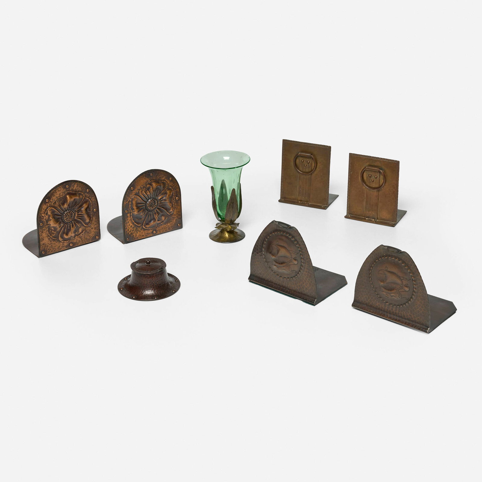 Roycroft, Collection of eight table articles: Roycroft Collection of eight table articles USA, c. 1915-25 handwrought copper and brass, glass largest: 6.25 h x 3.75 dia in (16 x 10 cm) smallest: 1.75 h x 4 dia in (4 x 10 cm) Collection is