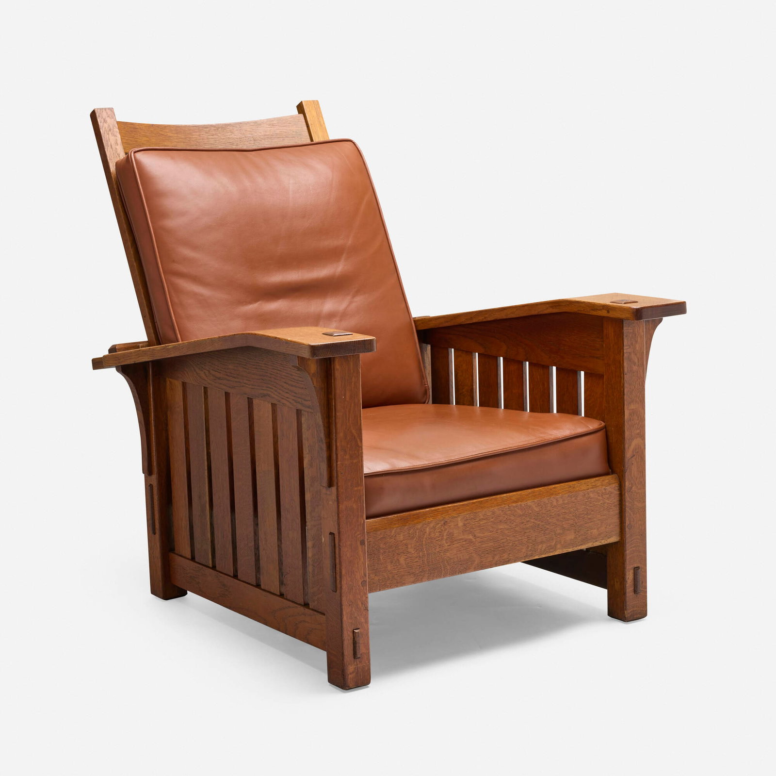 L. & J.G. Stickley, Drop-arm Morris chair, model 410: L. & J.G. Stickley Drop-arm Morris chair, model 410 USA, c. 1910-15 oak, leather 38 h x 32 w x 39 d in (97 x 81 x 99 cm) Provenance: Collection of Stuart Solomon, Florence, MA Literature: "Living