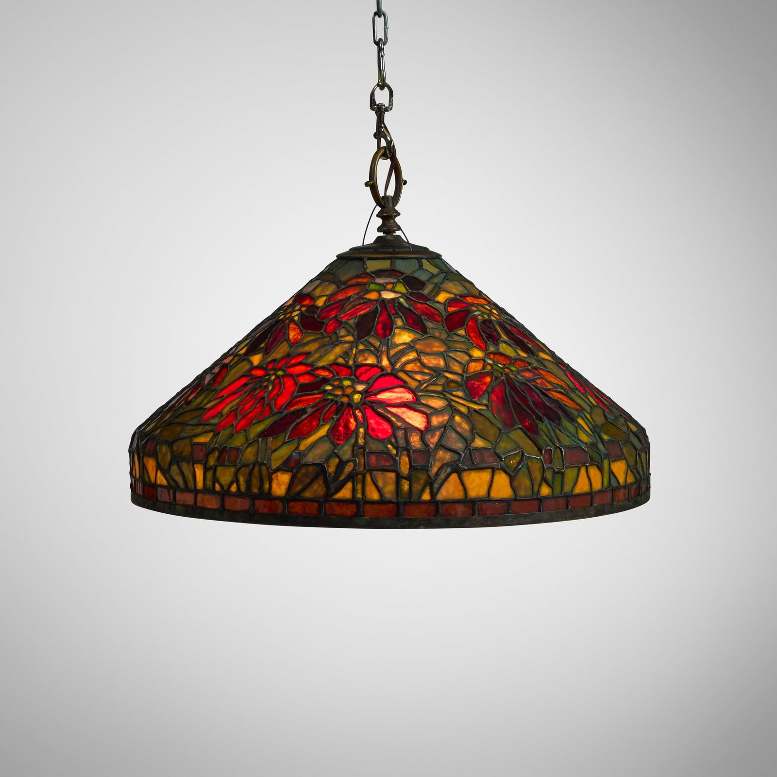 American, Hanging lamp with poinsettia: American Hanging lamp with poinsettia c. 1920 leaded glass, patinated brass 15.75 h x 24 dia in (40 x 61 cm) Provenance: Collection of Gary Diamond, Los Angeles This work will ship from Chicago,