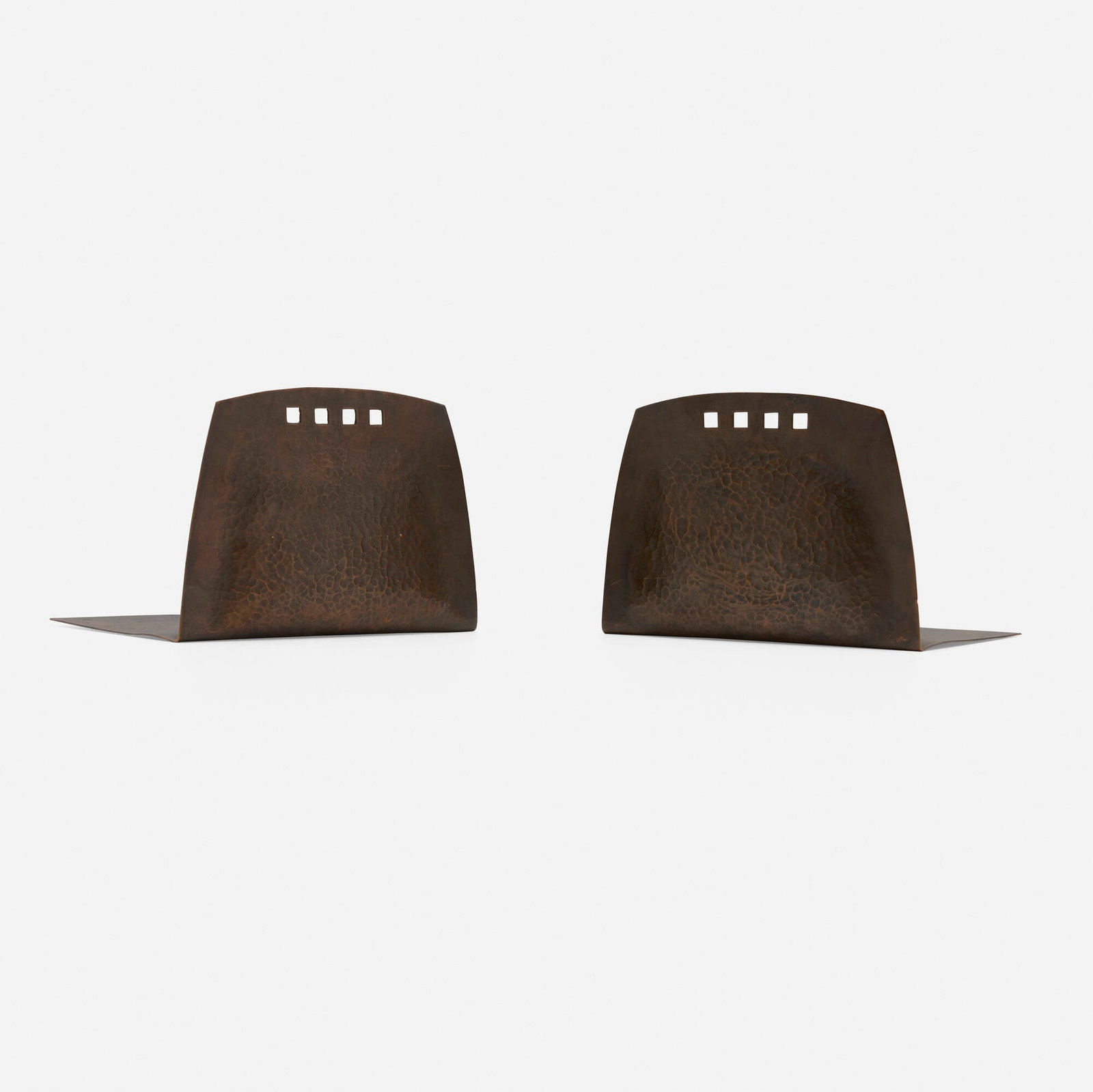 Karl Kipp, attribution for Roycroft, Bookends with cut-outs, pair: Karl Kipp, attribution for Roycroft Bookends with cut-outs, pair USA, c. 1911-12 handwrought copper 4.25 h x 6 w x 4.5 d in (11 x 15 x 11 cm) This form is Secessionist-influenced. Impressed orb and