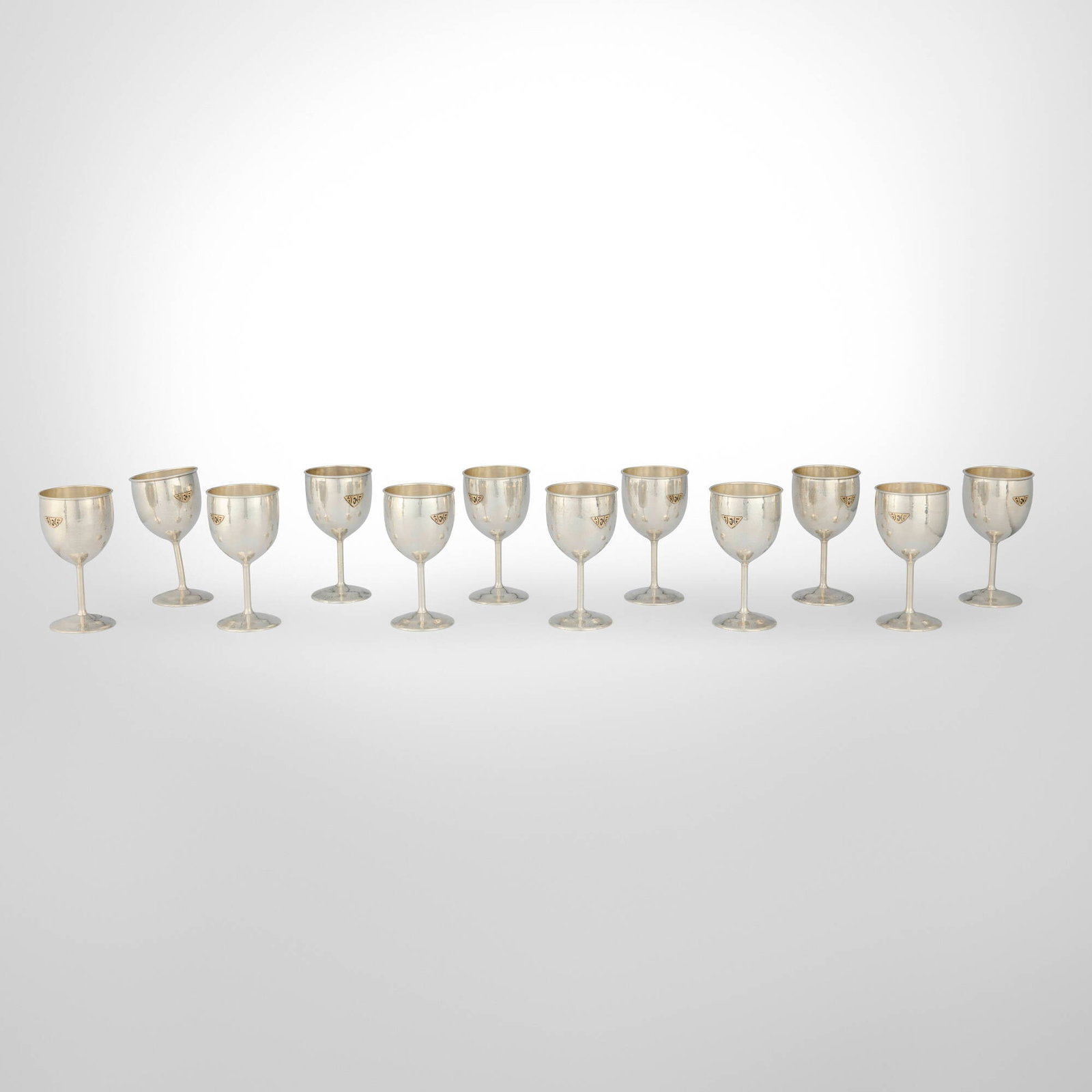 Lebolt & Co., Wine goblets, set of twelve: Lebolt & Co. Wine goblets, set of twelve Chicago, USA, c. 1940 sterling silver parcel-gilt 6.25 h x 3.25 dia in (16 x 8 cm) Impressed manufacturer's mark and number to underside of each example