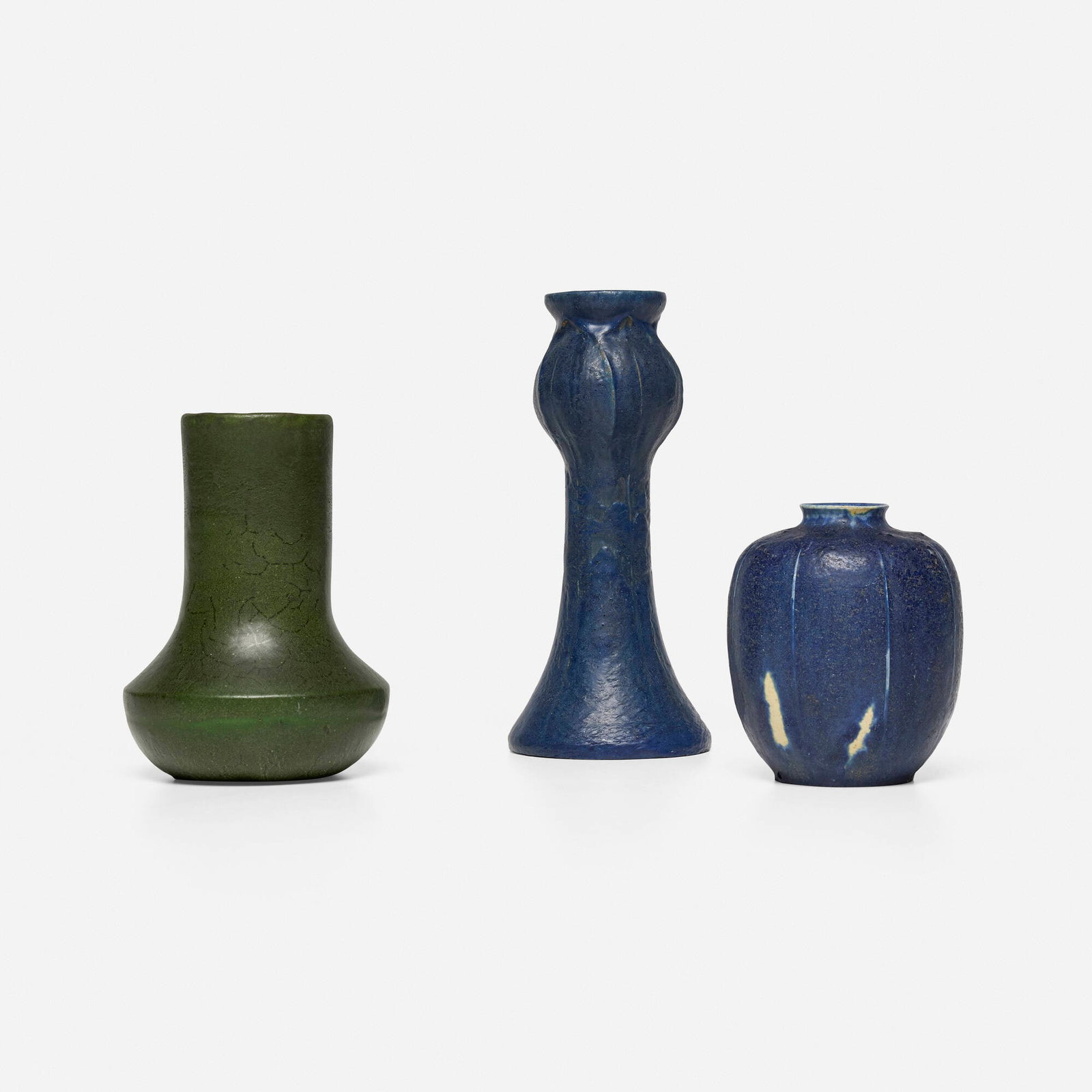 Grueby Faience Company, Collection of three vases: Grueby Faience Company Collection of three vases USA, 1899-1910 glazed earthenware 8.625 h x 3.75 dia in (22 x 10 cm) 6.25 h x 4.5 dia in (16 x 11 cm) 4.75 h x 4 dia in (12 x 10 cm) Partial
