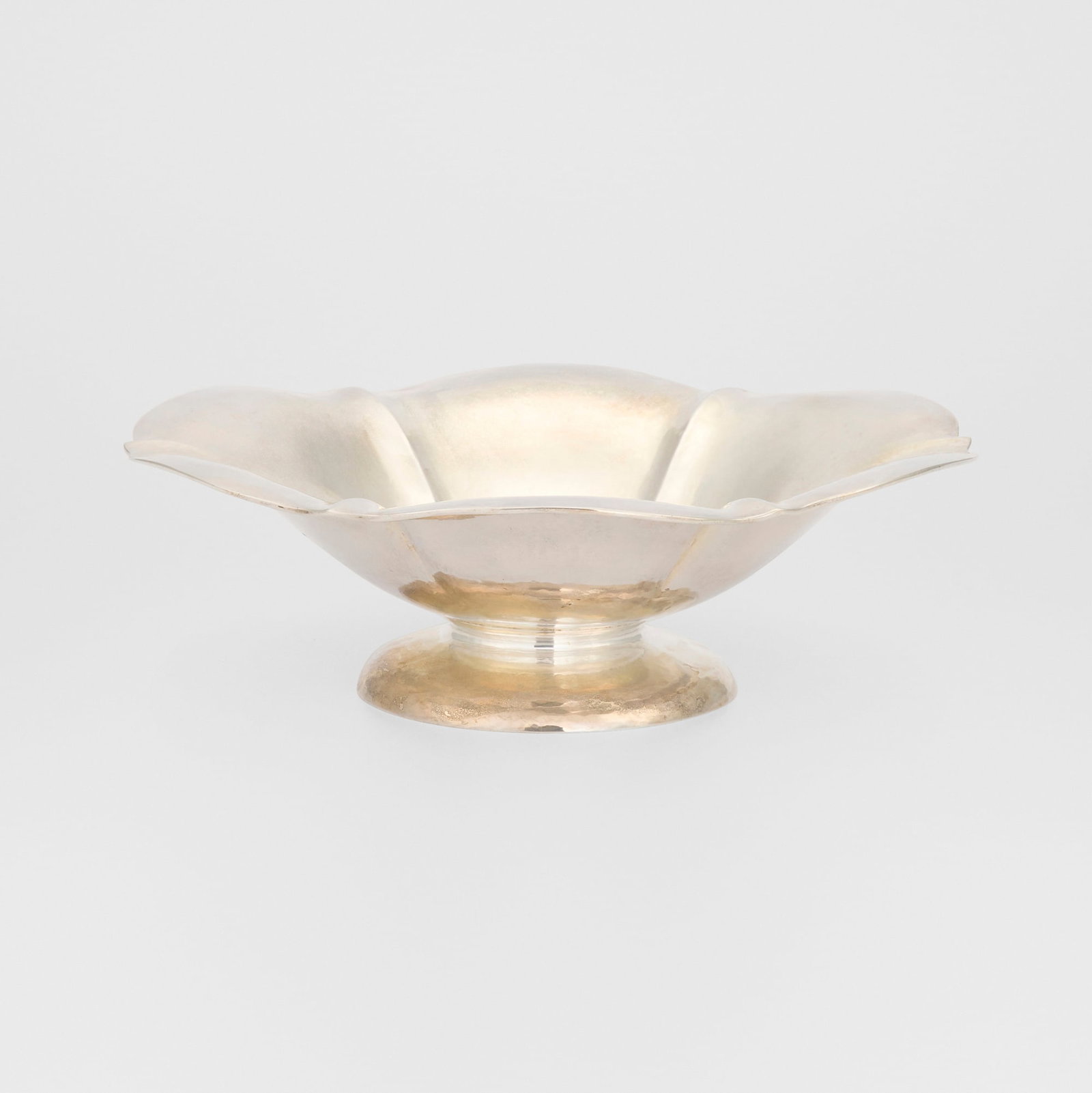 Clemens Friedell, Round footed floriform bowl: Clemens Friedell Round footed floriform bowl Pasadena, USA, c. 1915 sterling silver 3 h x 10 dia in (8 x 25 cm) Incised signature to underside 'Clemens Friedell'. Impressed