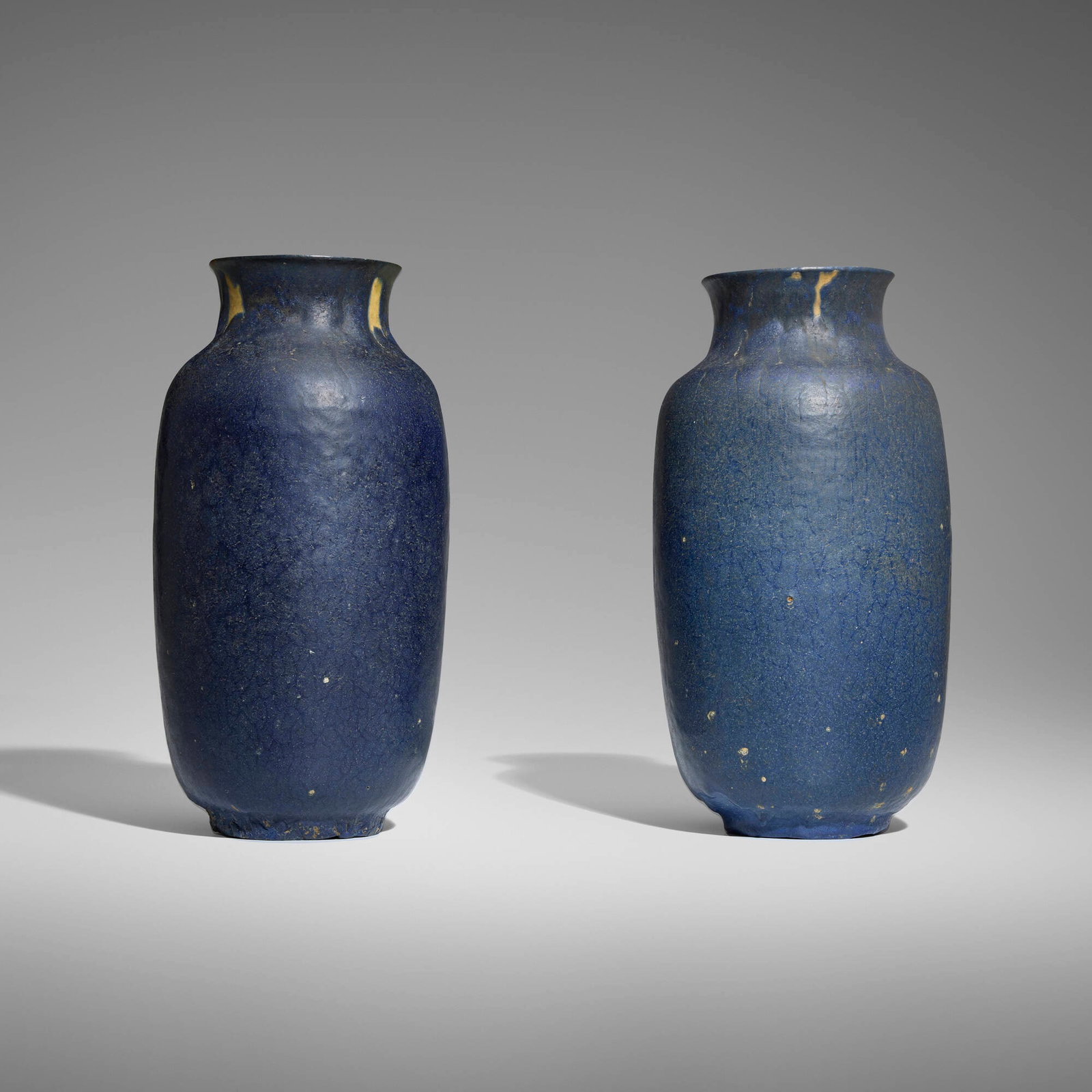 Grueby Faience Company, Vases, set of two: Grueby Faience Company Vases, set of two USA, 1899-1910 glazed earthenware 9.75 h x 5 dia in (25 x 13 cm) 9.75 h x 4.875 dia in (25 x 12 cm) Impressed manufacturer's mark and number to underside
