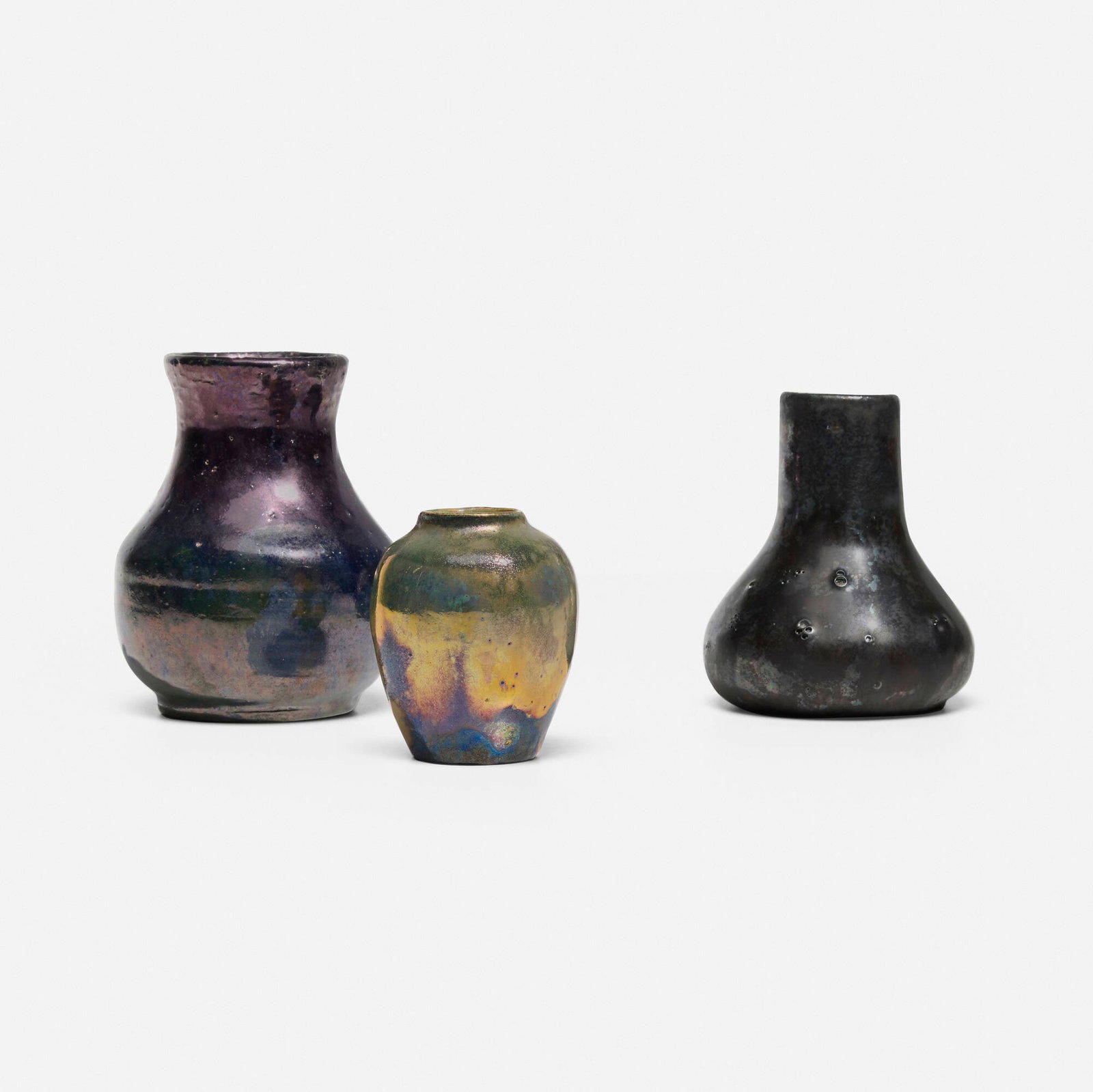 Pewabic Pottery, Collection of three cabinet vases: Pewabic Pottery Collection of three cabinet vases USA, c. 1915-30 iridescent-glazed earthenware 3.5 h x 2.75 dia in (9 x 7 cm) 3.25 h x 2.5 dia in (8 x 6 cm) 2.5 h x 2 dia in (6 x 5 cm) Impressed