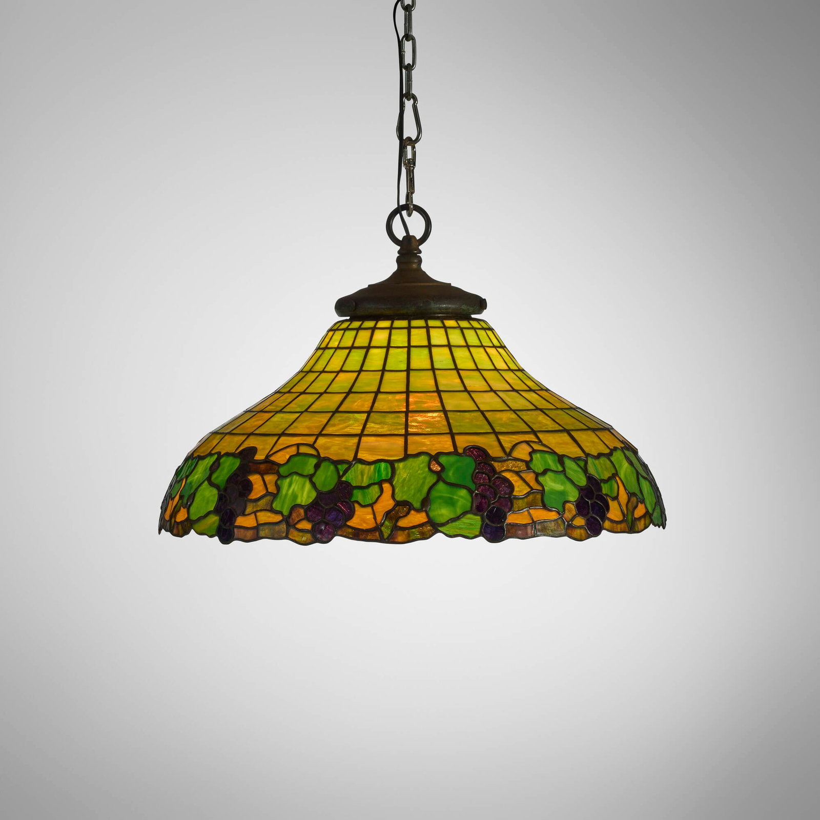 American, Hanging lamp with grapevine: American Hanging lamp with grapevine c. 1920 slag glass, patinated metal 13.5 h x 22.25 dia in (34 x 57 cm) Metal manufacturer's label near socket '13311'. Provenance: Collection of