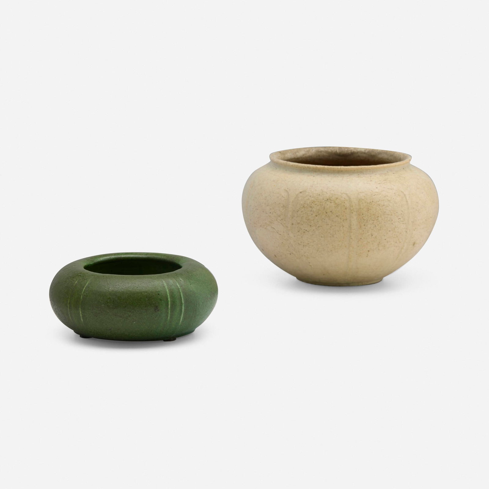 Grueby Faience Company, Vases with leaves, set of two: Grueby Faience Company Vases with leaves, set of two USA, 1898-1910 glazed earthenware 3.75 h x 5.25 dia in (10 x 13 cm) 1.75 h x 4 dia in (4 x 10 cm) Set includes one example by Wilhelmina Post.