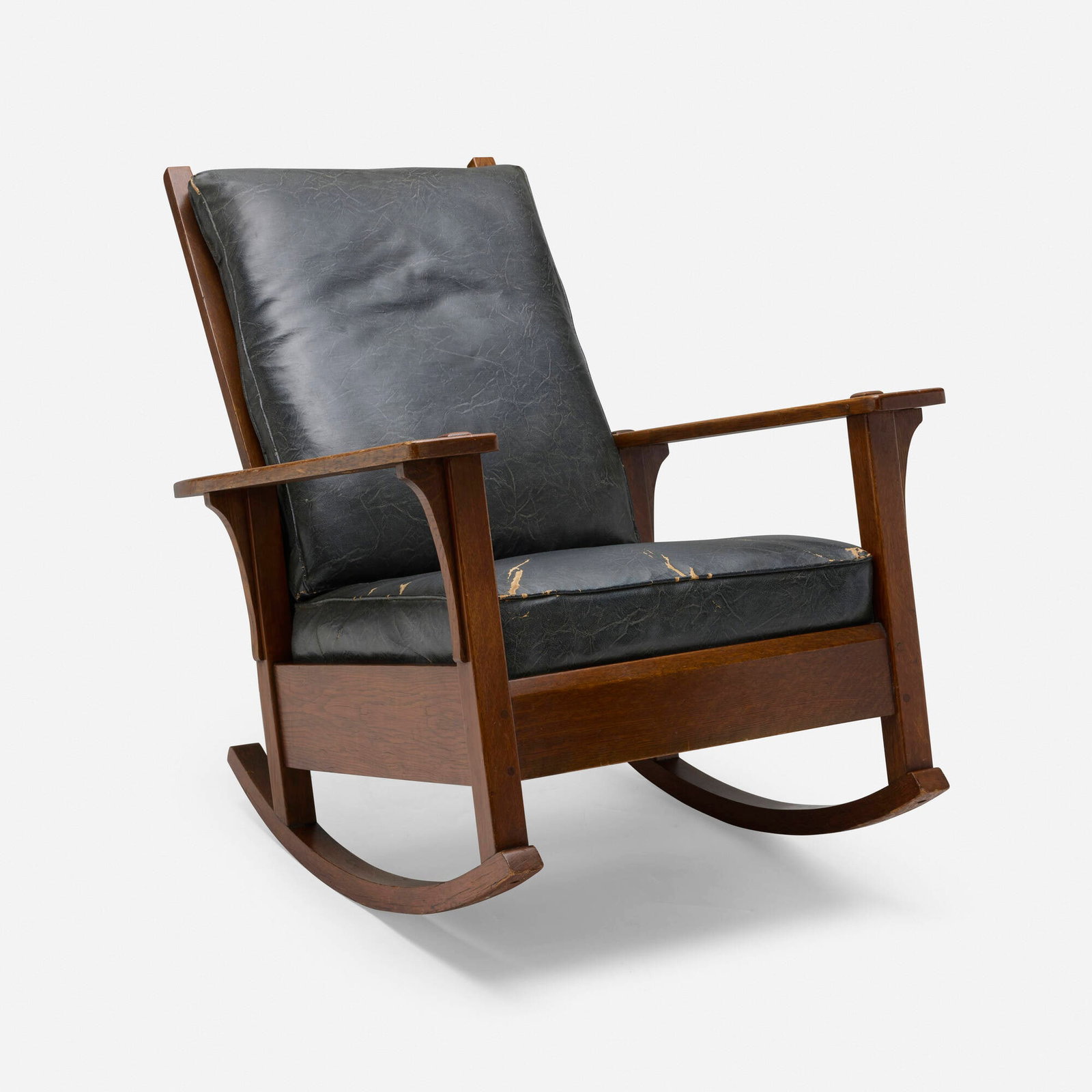 L. & J.G. Stickley, Rocking armchair, model 413: L. & J.G. Stickley Rocking armchair, model 413 USA, c. 1913 oak, leatherette 34 h x 29 w x 39 d in (86 x 74 x 99 cm) Decal manufacturer's label to underside 'The Work of L. & J.G. Stickley'.