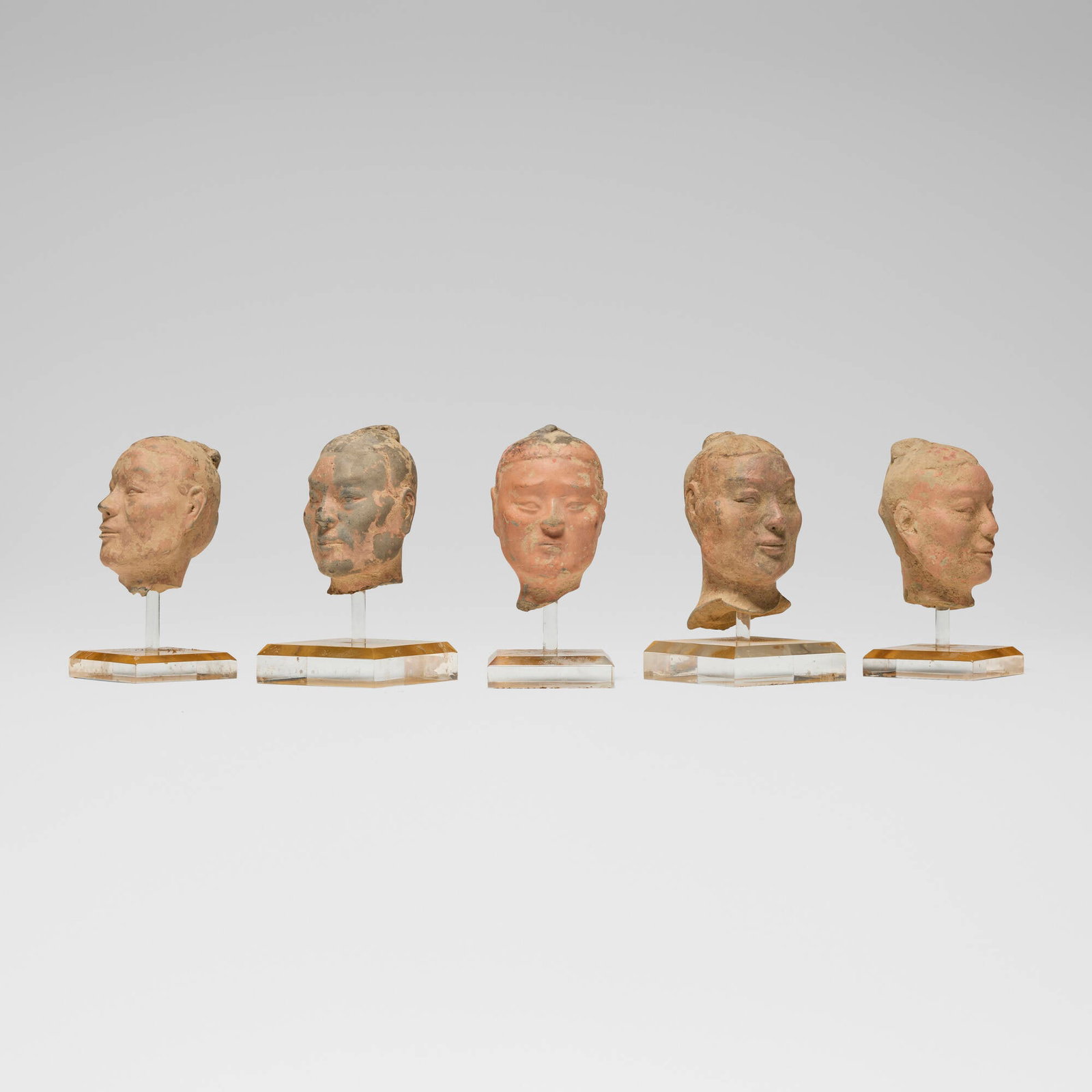 Chinese, Collection of five warrior heads: Chinese Collection of five warrior heads Han dynasty or later terracotta, pigment largest: 5 h x 3 w x 3 d in (13 x 8 x 8 cm) smallest: 4 h x 3 w x 3 d in (10 x 8 x 8 cm) This work will ship from Los